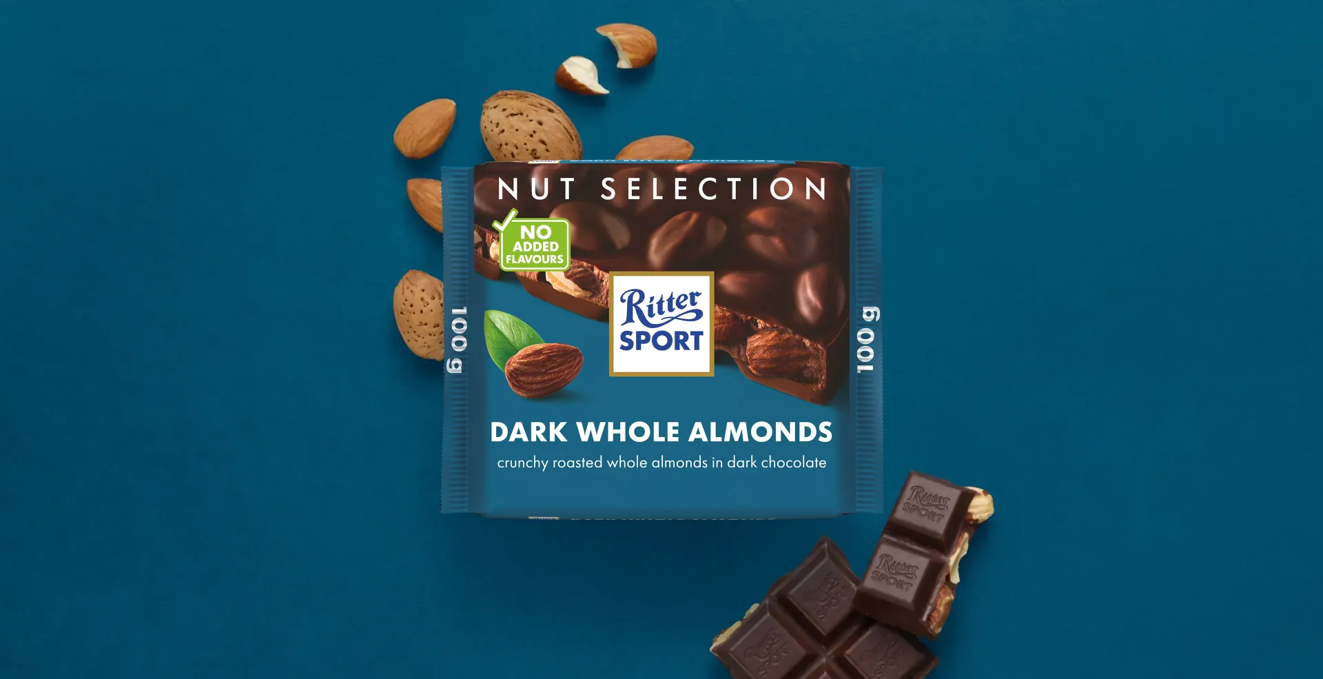 Ritter Sport chocolate bar packaging with cocoa beans, broken chocolate, and milk on a blue background.