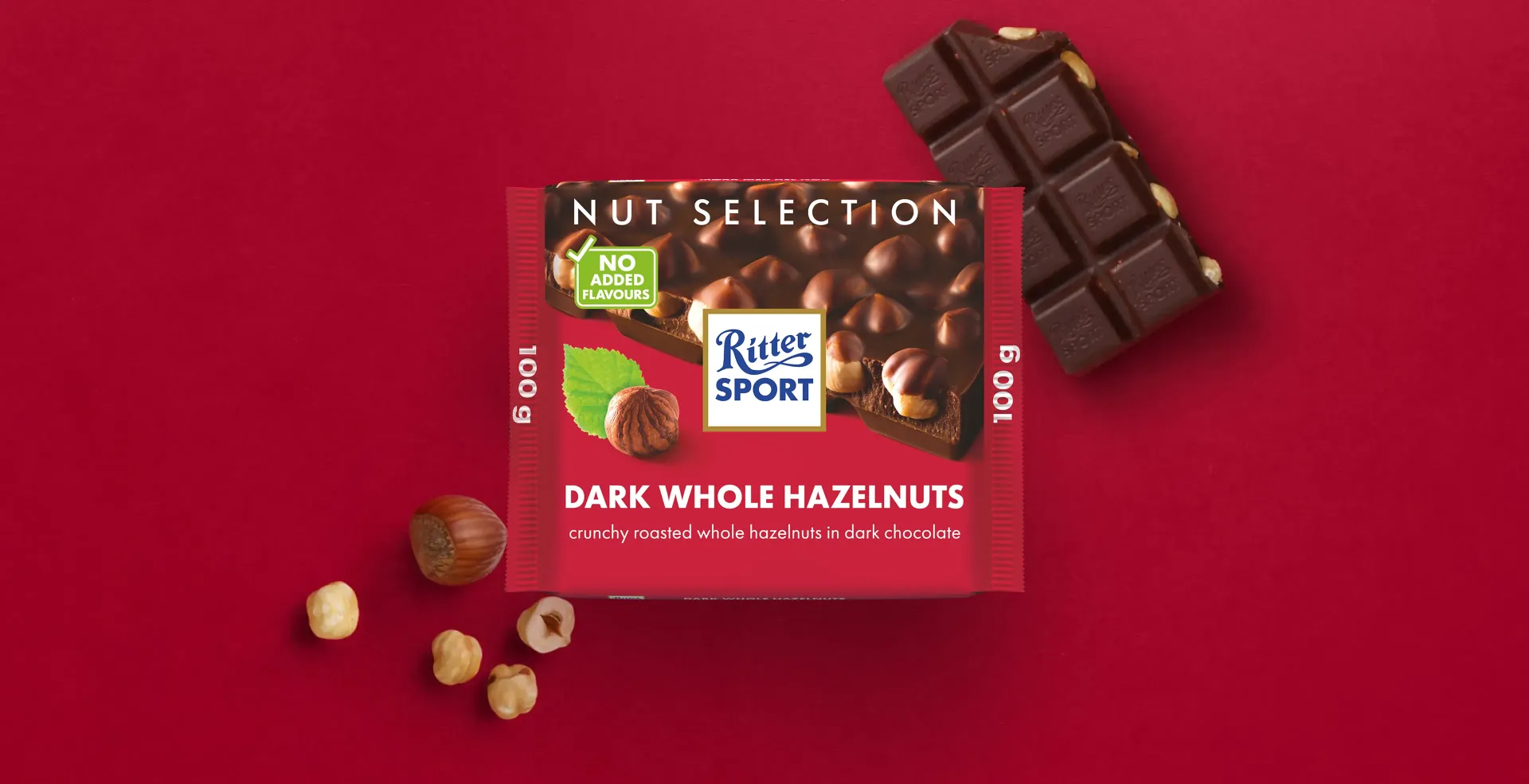 Ritter Sport chocolate bar packaging with cocoa beans, broken chocolate, and milk on a blue background.