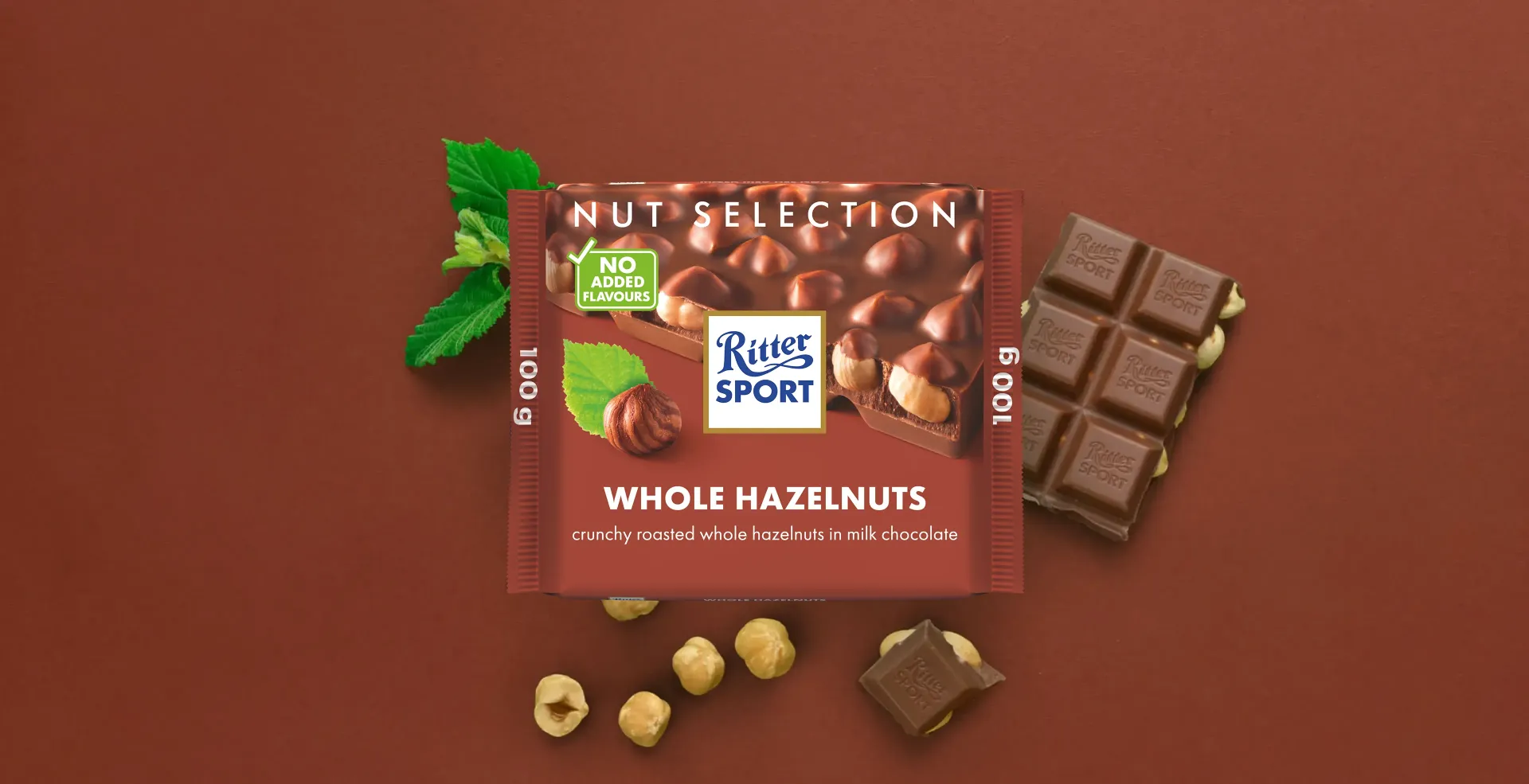 Ritter Sport chocolate bar packaging with cocoa beans, broken chocolate, and milk on a blue background.