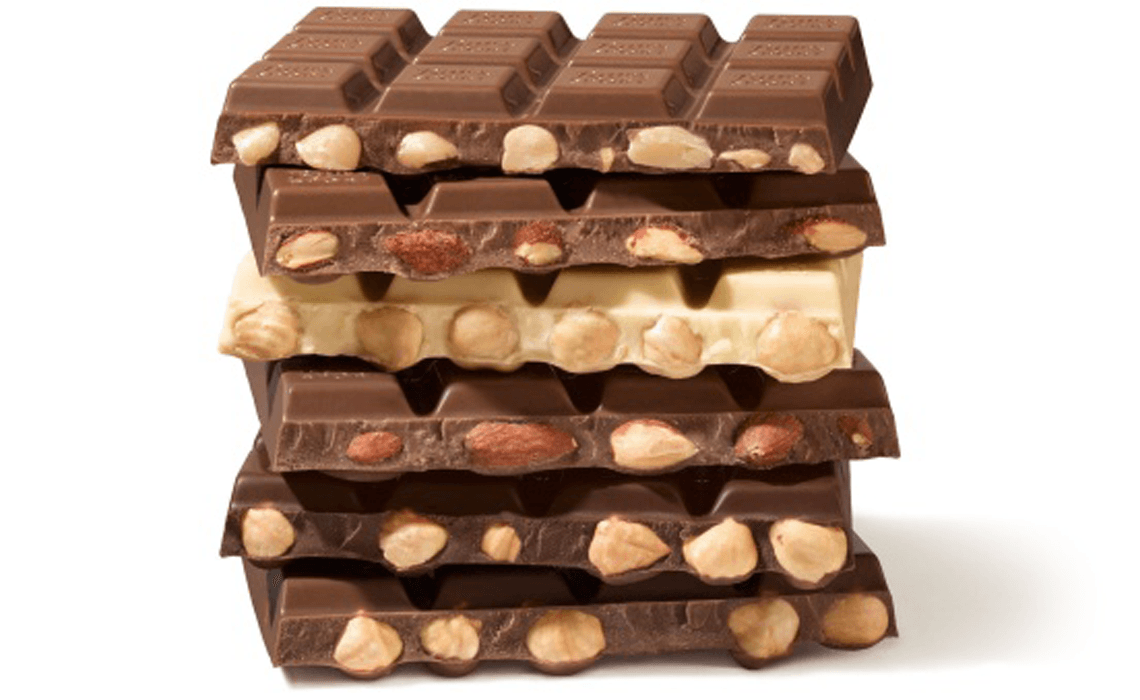 A stack of Ritter Sport chocolate bars with nuts in them