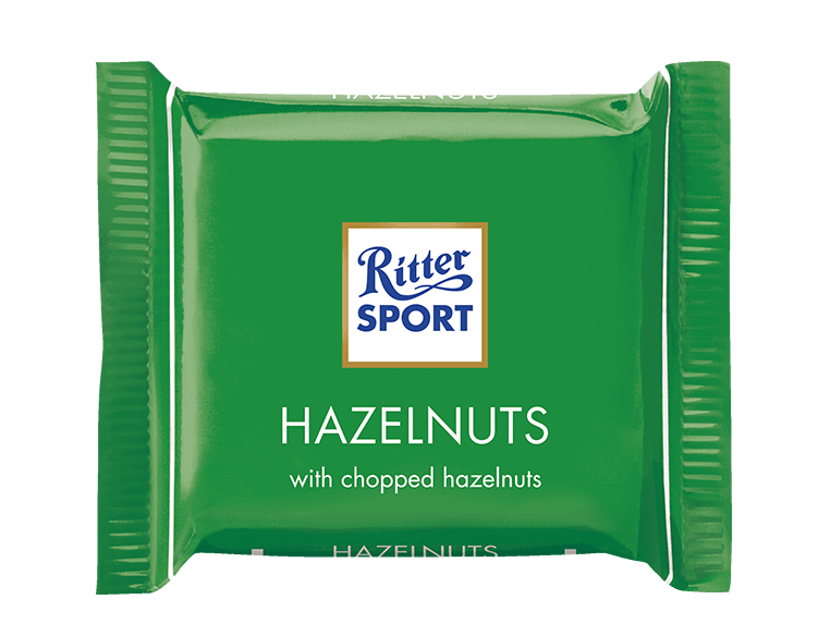 A green package of ritter sport hazelnuts with chopped hazelnuts