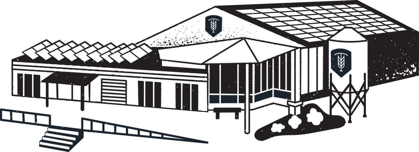 Building with logo, possibly a school or business, with ramps and steps in front.