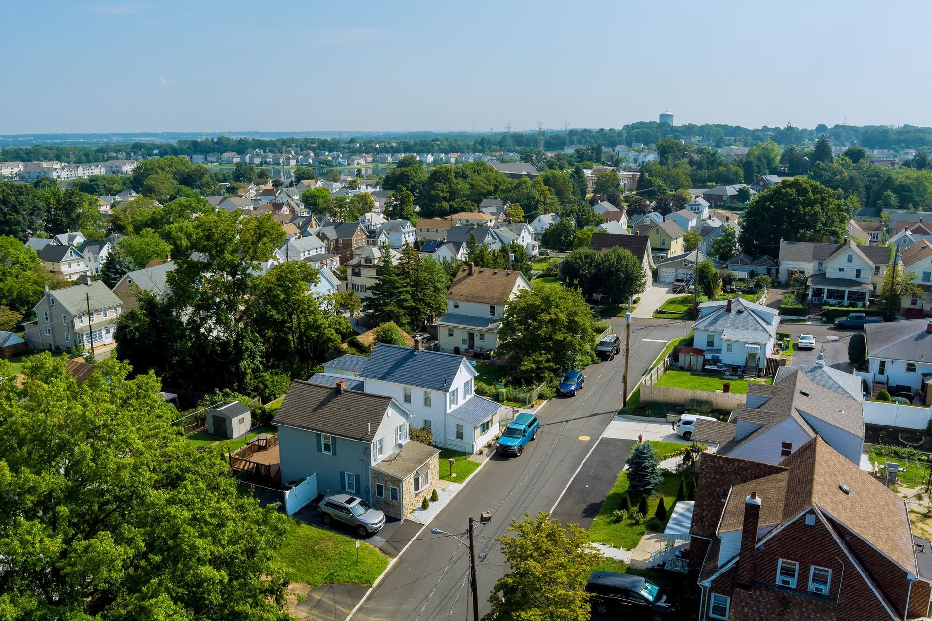 An aerial view of a residential area with lots of houses and trees.