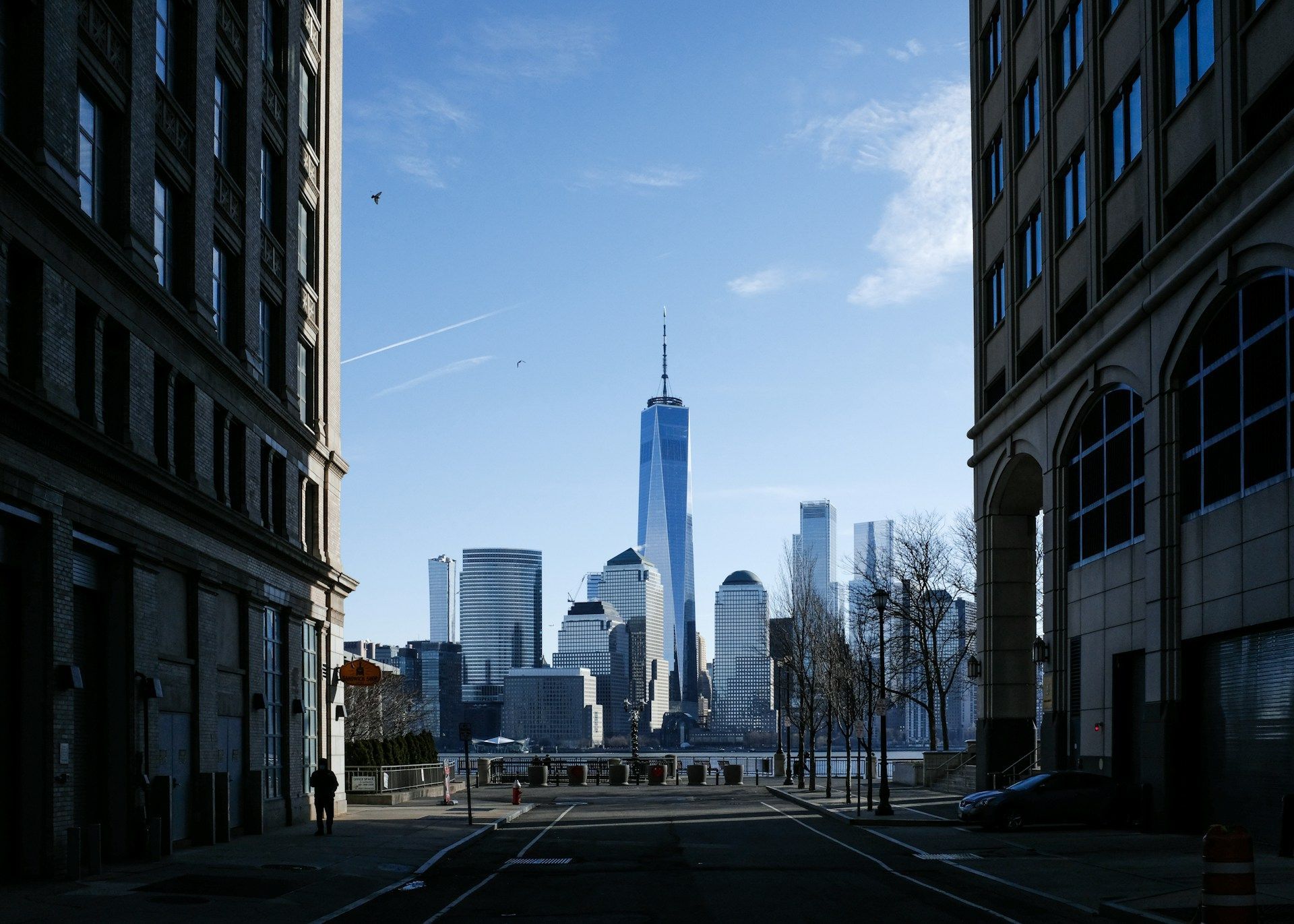 A city street with a skyline in the background