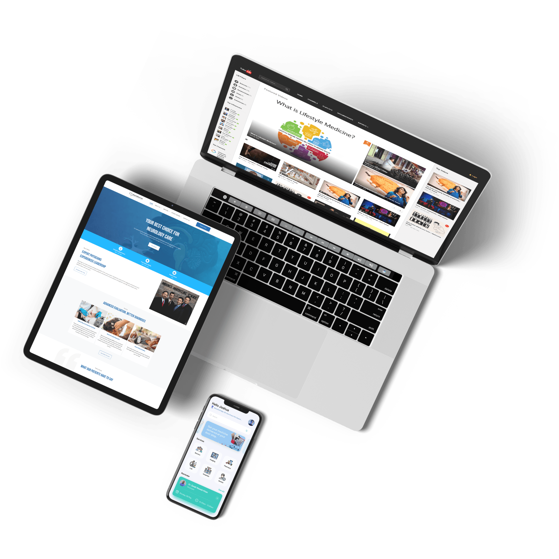 Laptop, tablet, and smartphone showing websites on a white background.