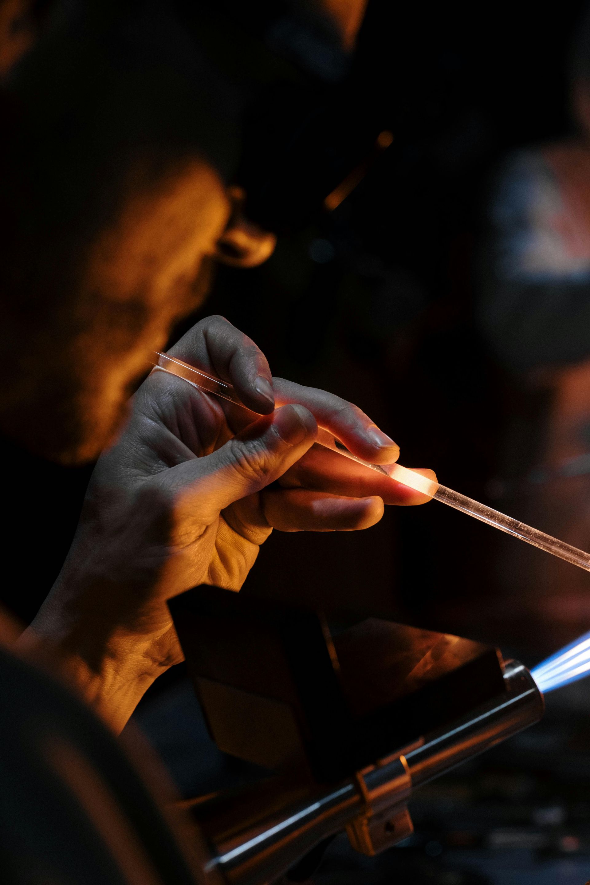 A close up of a person holding a lighter in their hand