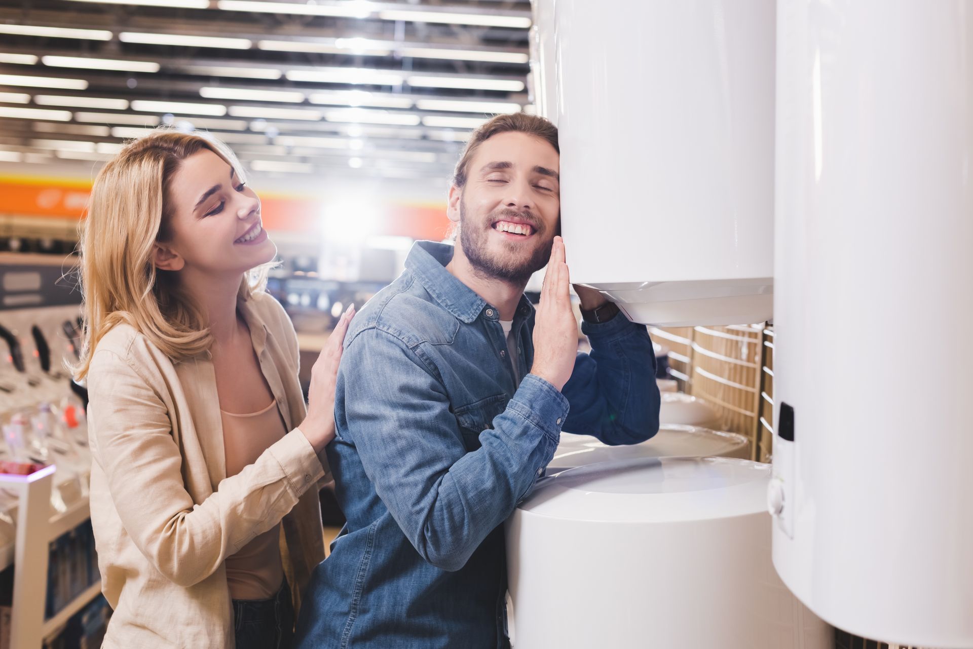 A man and a woman are hugging in front of a house.