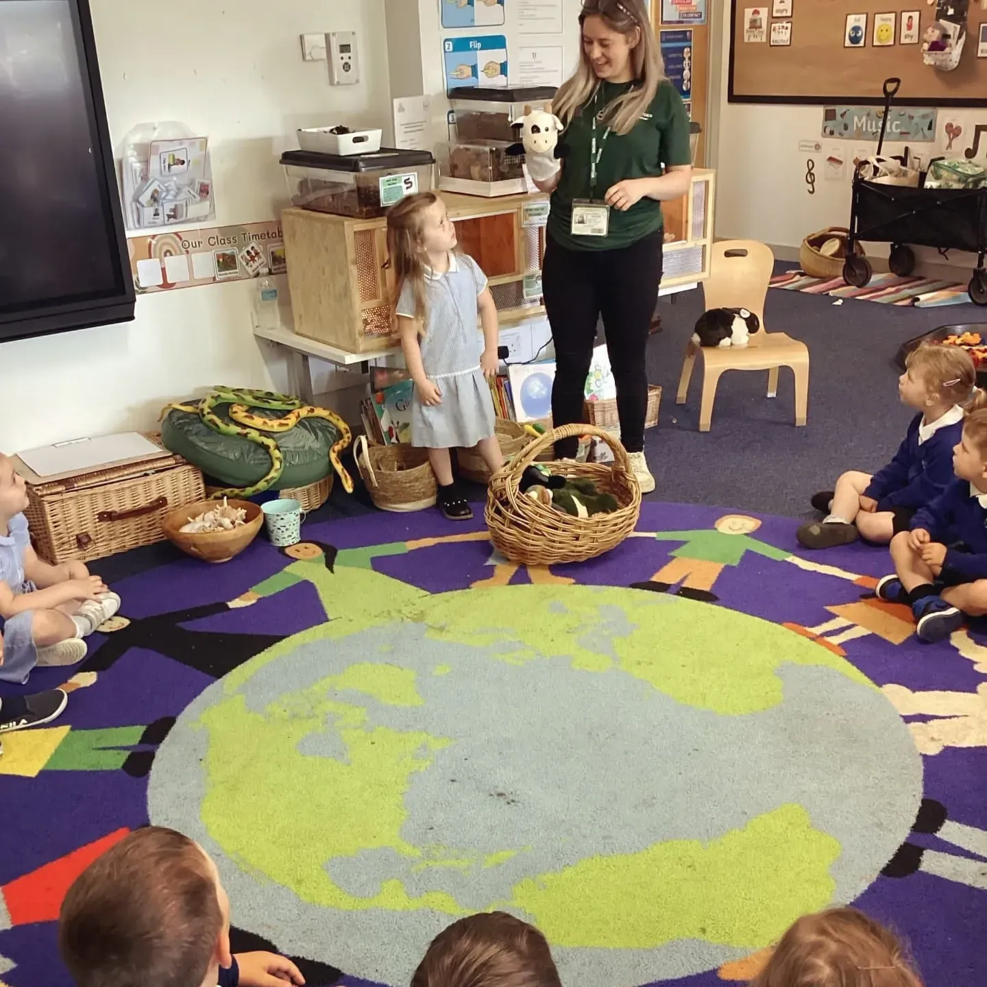 Presenter in a school teaching nursery about animals