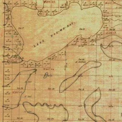 Old map showing Lake Nok-we-bay, Michigan, with land divisions and property lines.