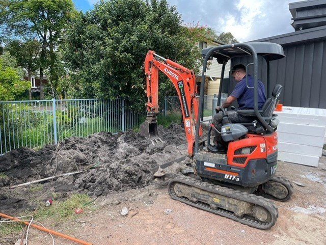 Electrician digging a trench — Electrician in Port Stephens, NSW