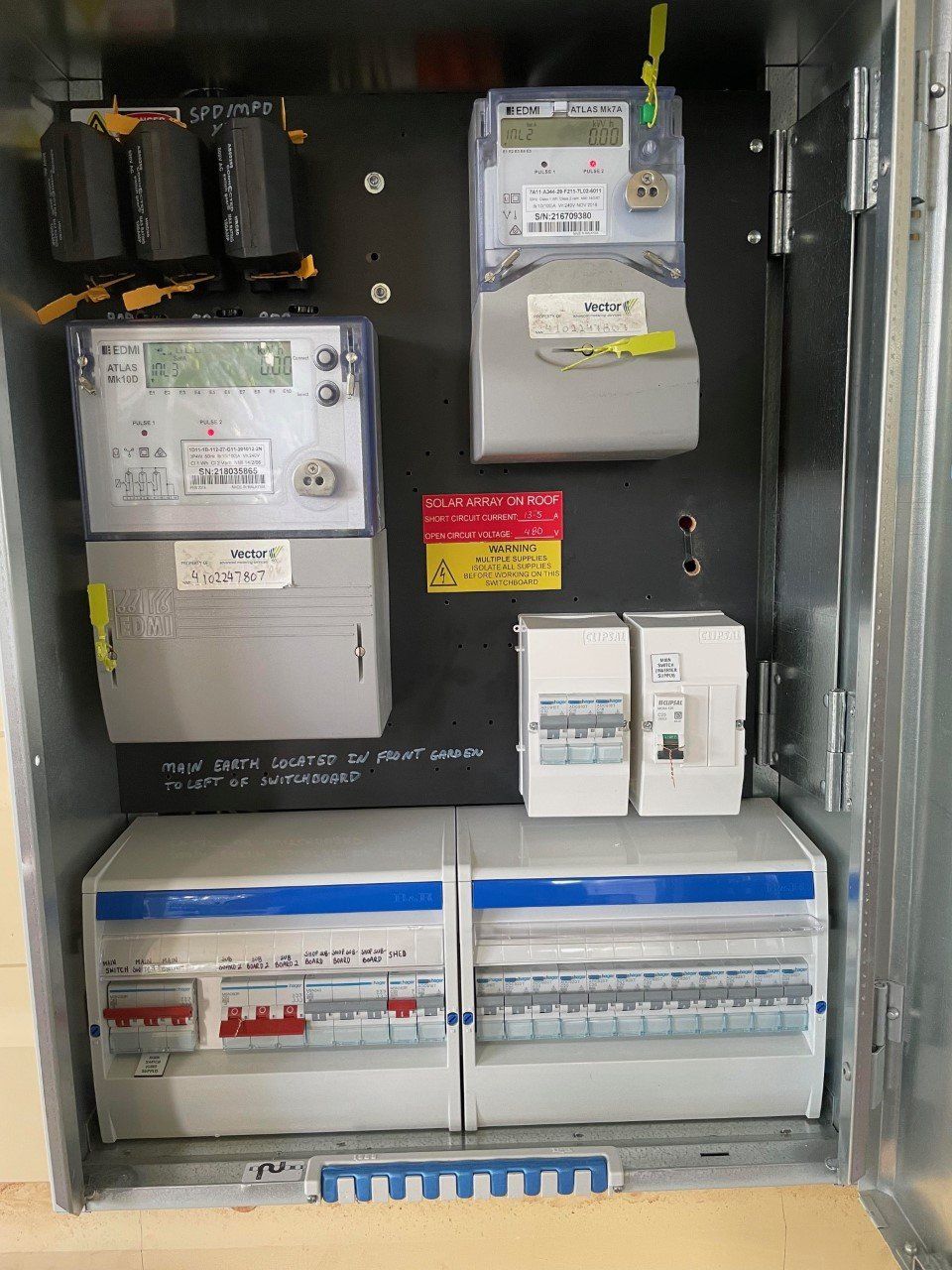 Electrician With Protective Gloves Installing Circuit Breaker — Electrician in Maitland, NSW