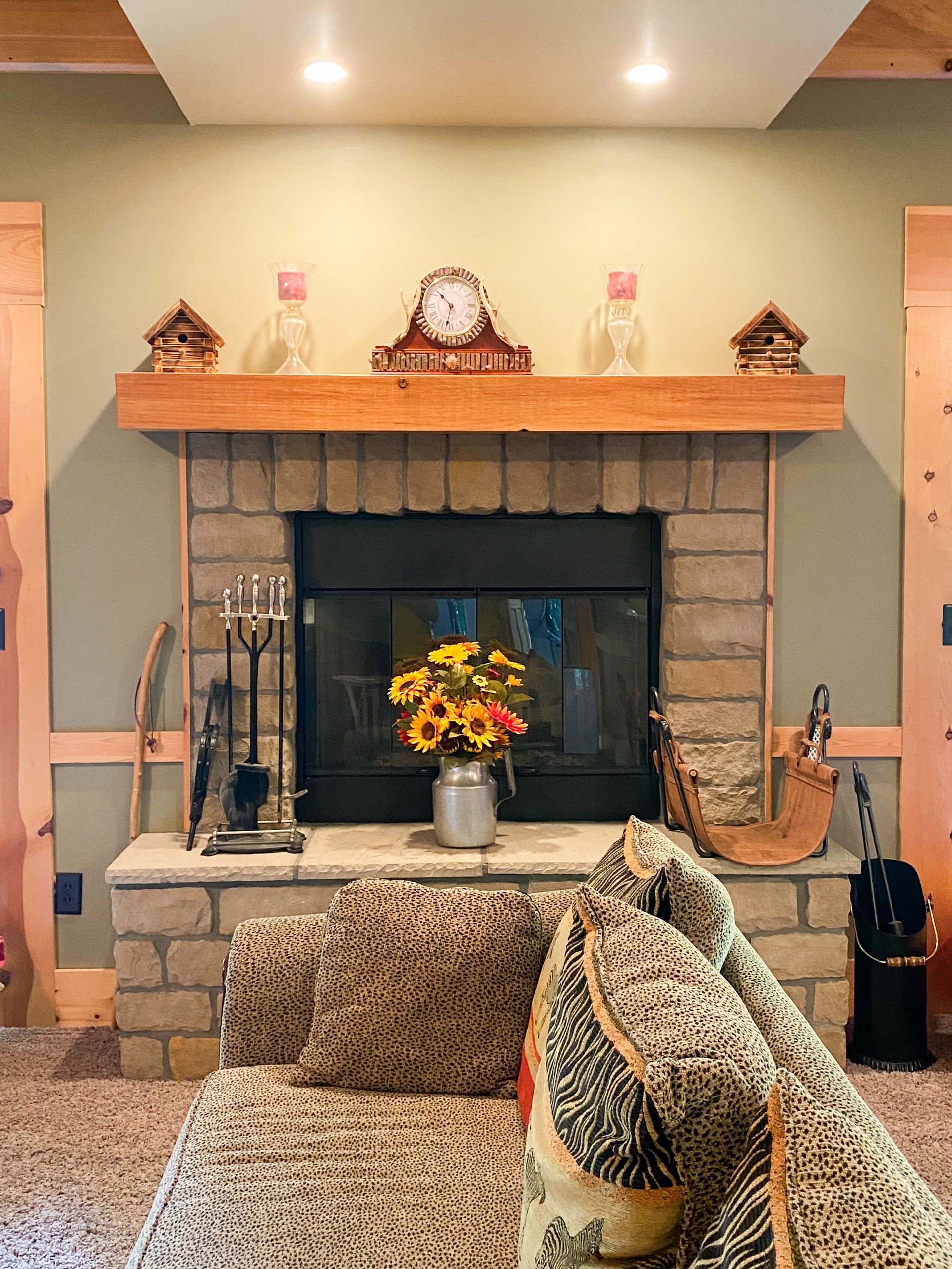 A living room with a fireplace and a couch