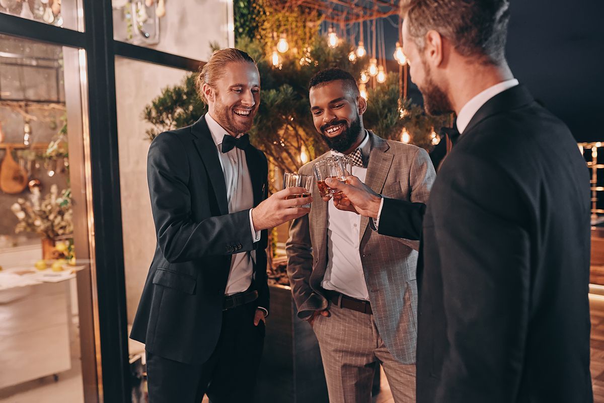 group of gentlemen having a toast