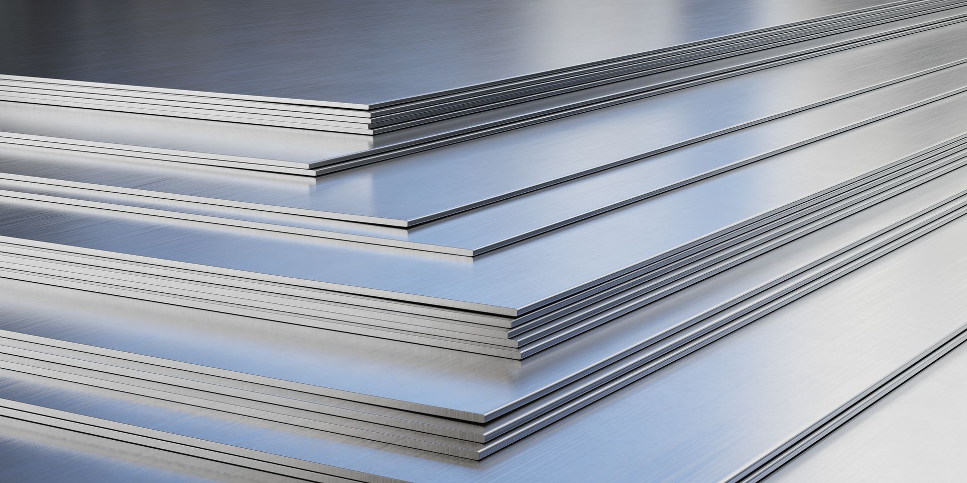 A stack of metal sheets stacked on top of each other on a table.