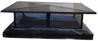 A black metal chimney cap is sitting on top of a black base.