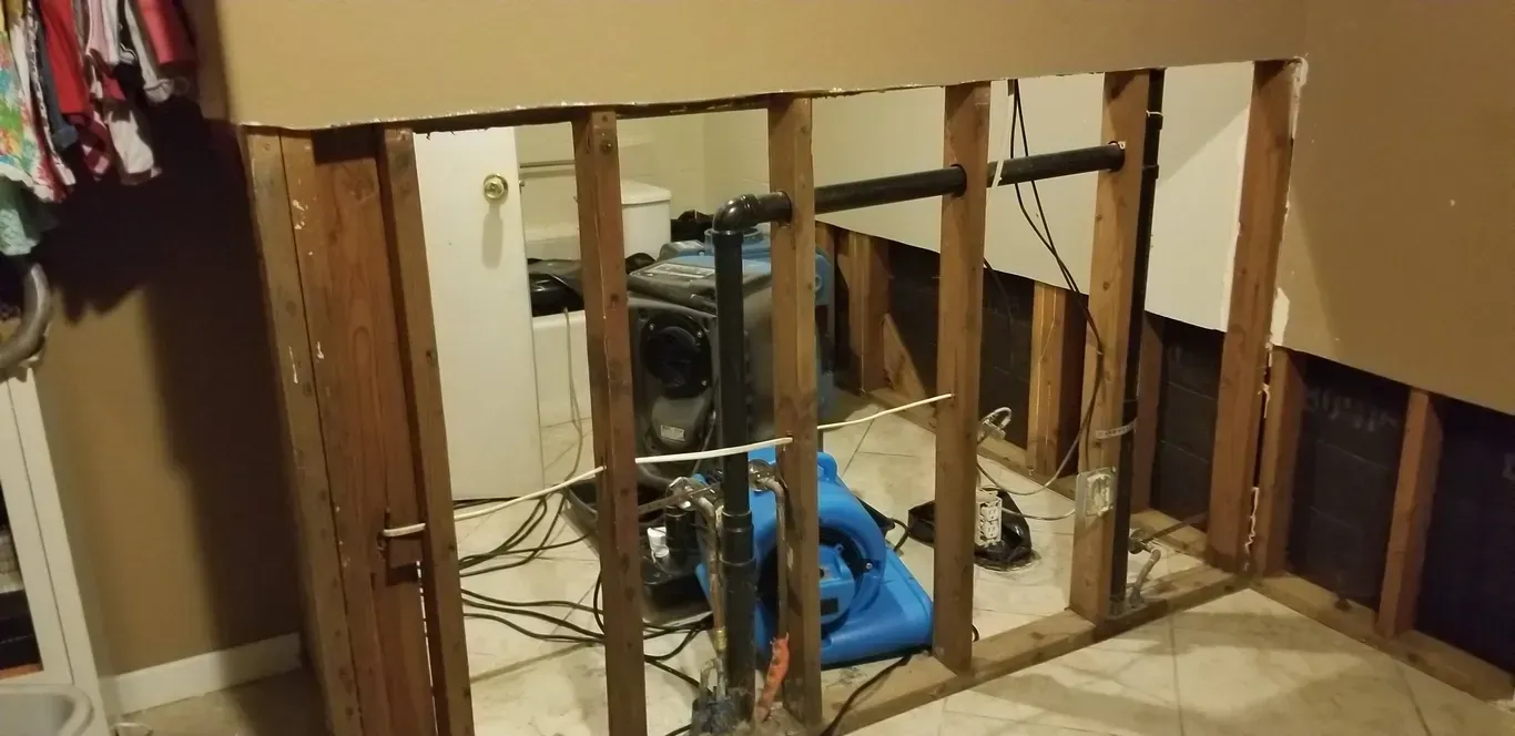 A room with wooden beams and a vacuum cleaner in it.