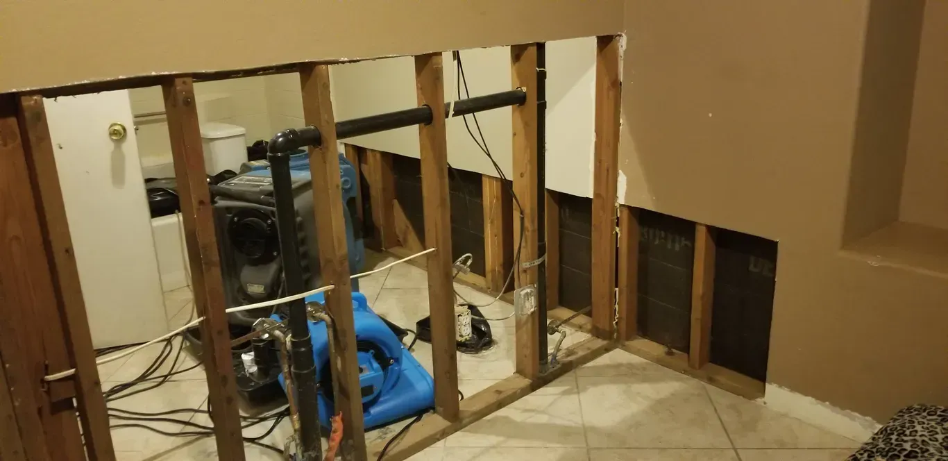 A room with wooden beams and a vacuum cleaner in it.