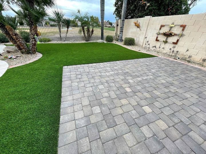 Backyard With Stone And Artificial Turf