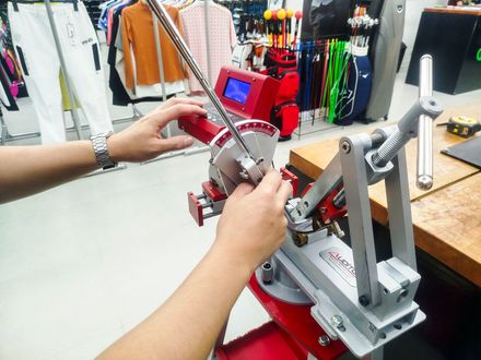 A person is working on a machine in a store.