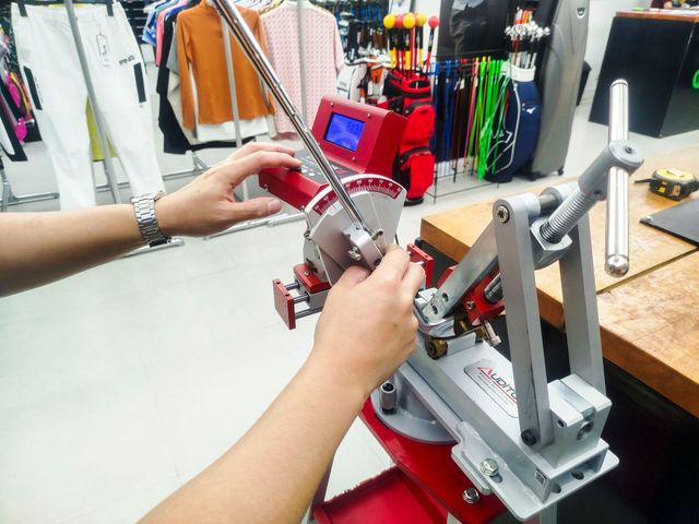 A person is working on a machine in a store.