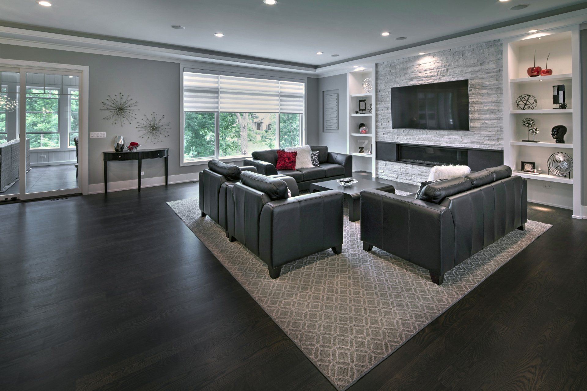 A living room filled with furniture and a flat screen tv.