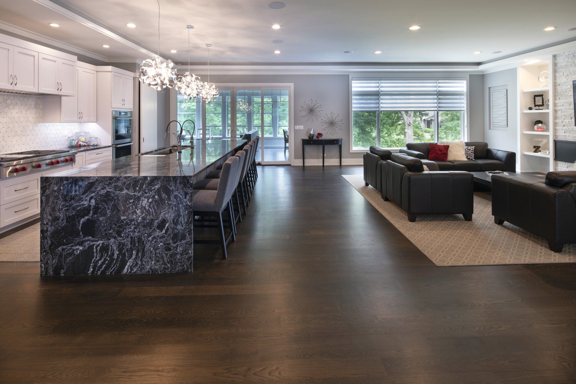 A large living room with a kitchen , dining room , and living room.