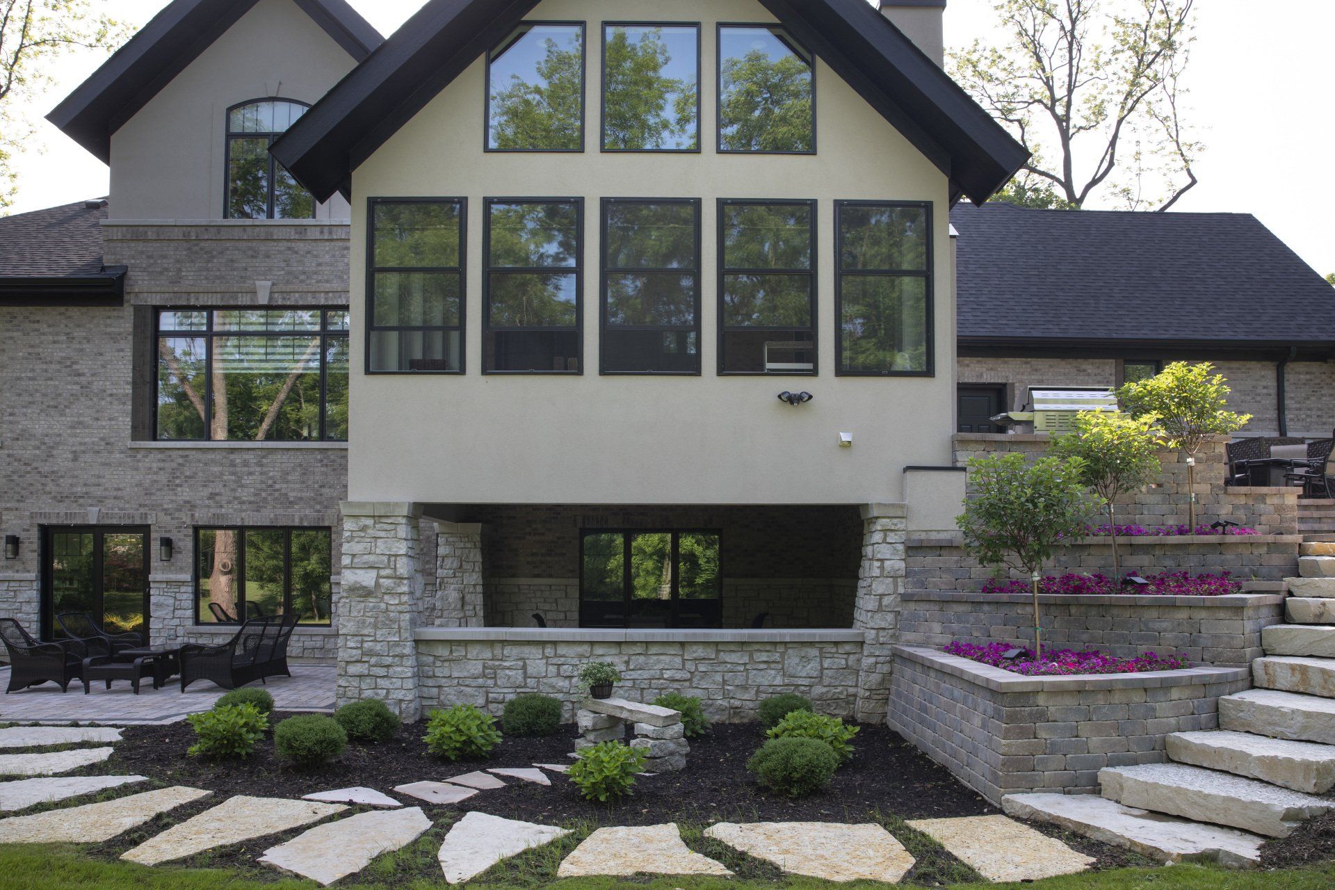 A large house with a lot of windows and stairs