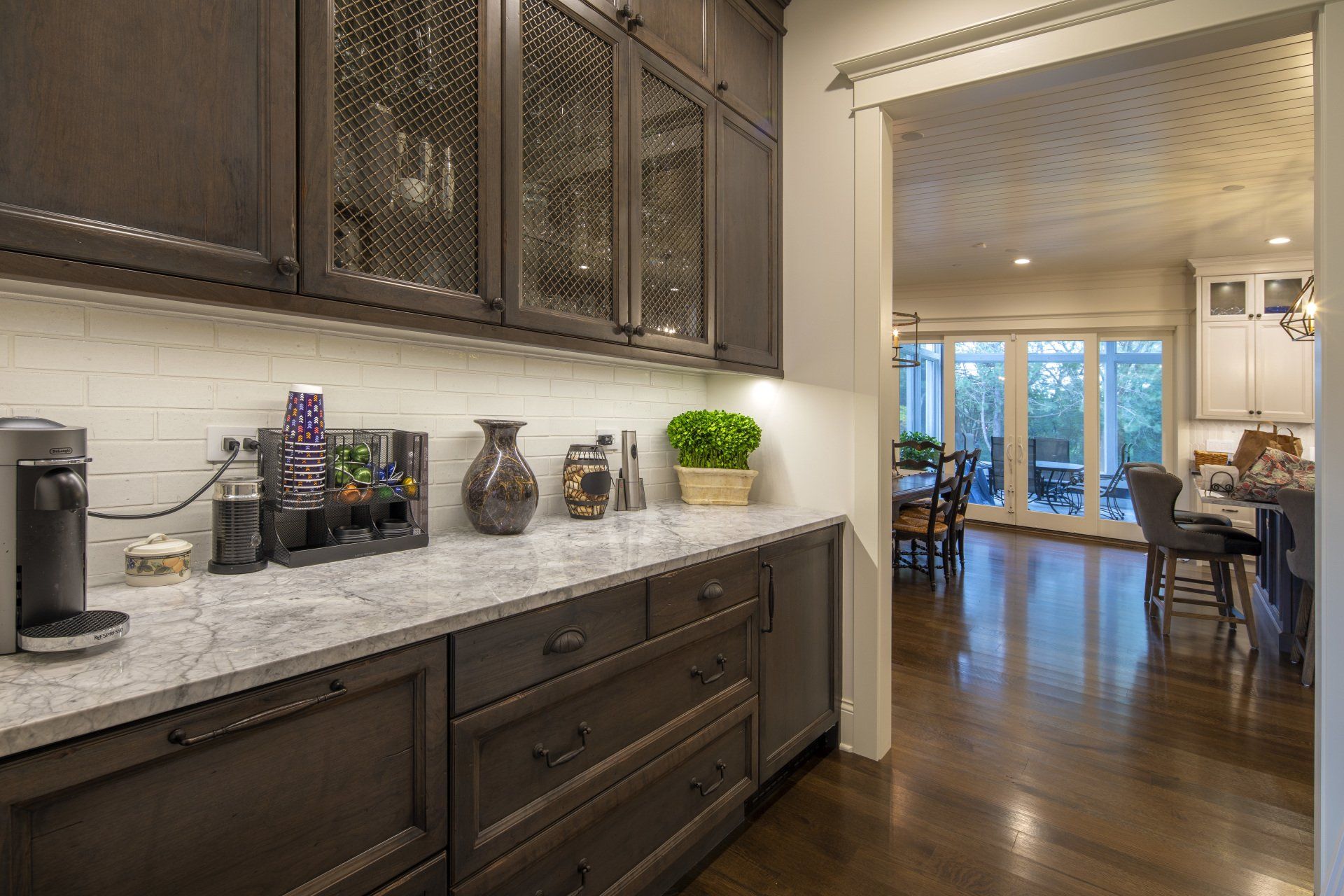 A kitchen with a lot of cabinets and a coffee maker on the counter.
