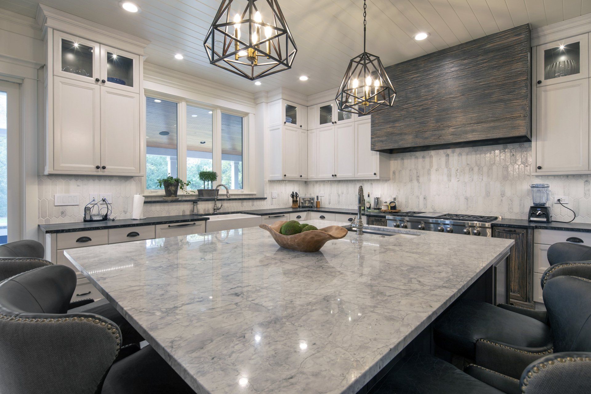 There is a large island in the middle of the kitchen.