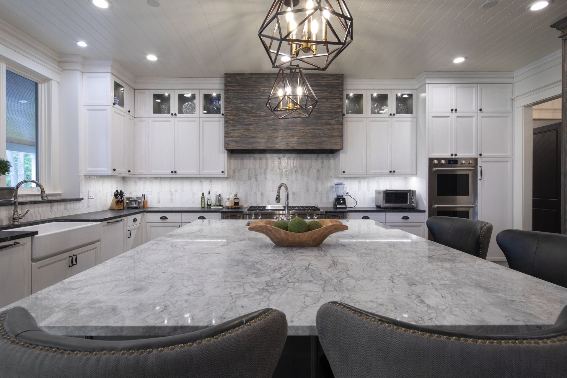 There is a large island in the middle of the kitchen.