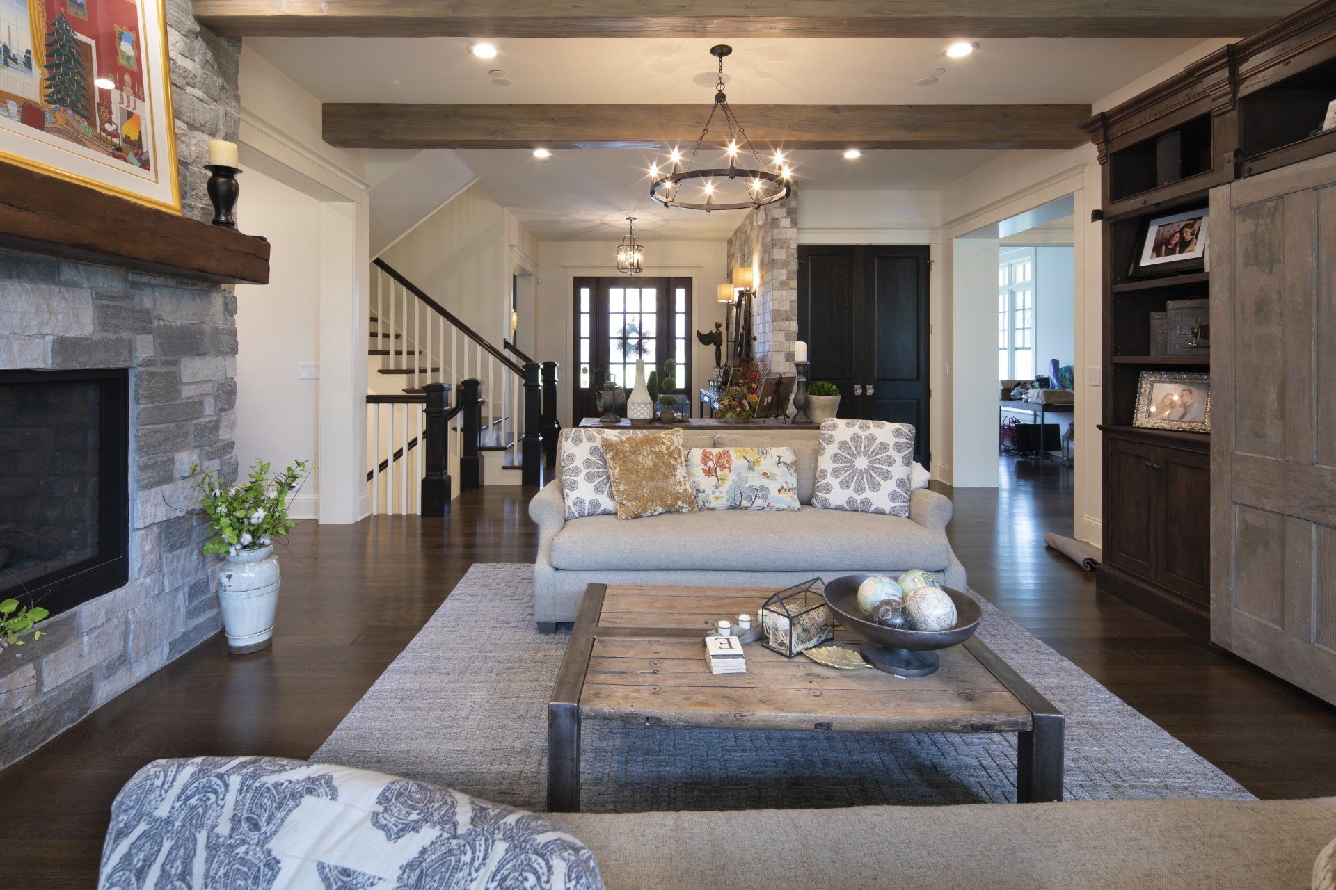 A living room with a couch , coffee table and fireplace.