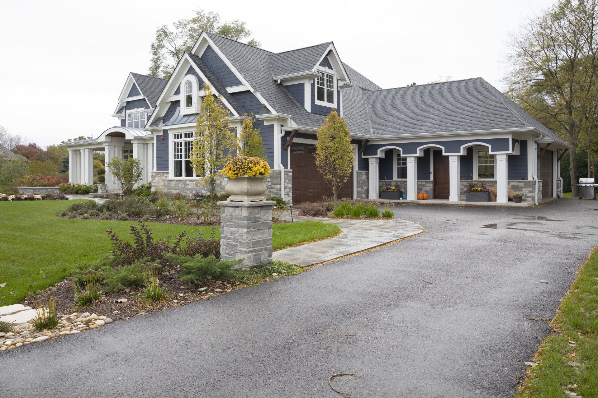 A large house with a driveway leading to it