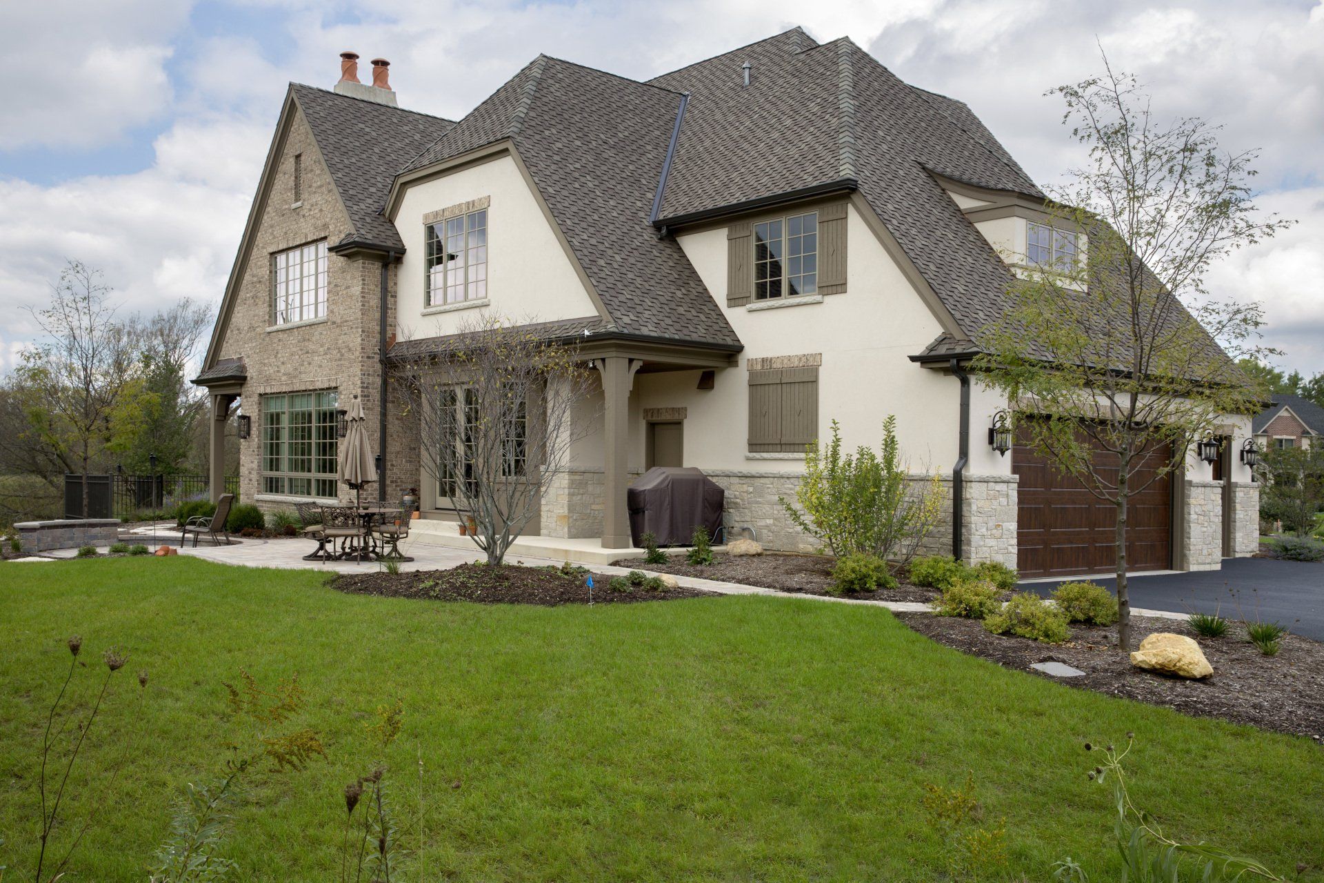 A large house with a large lawn in front of it