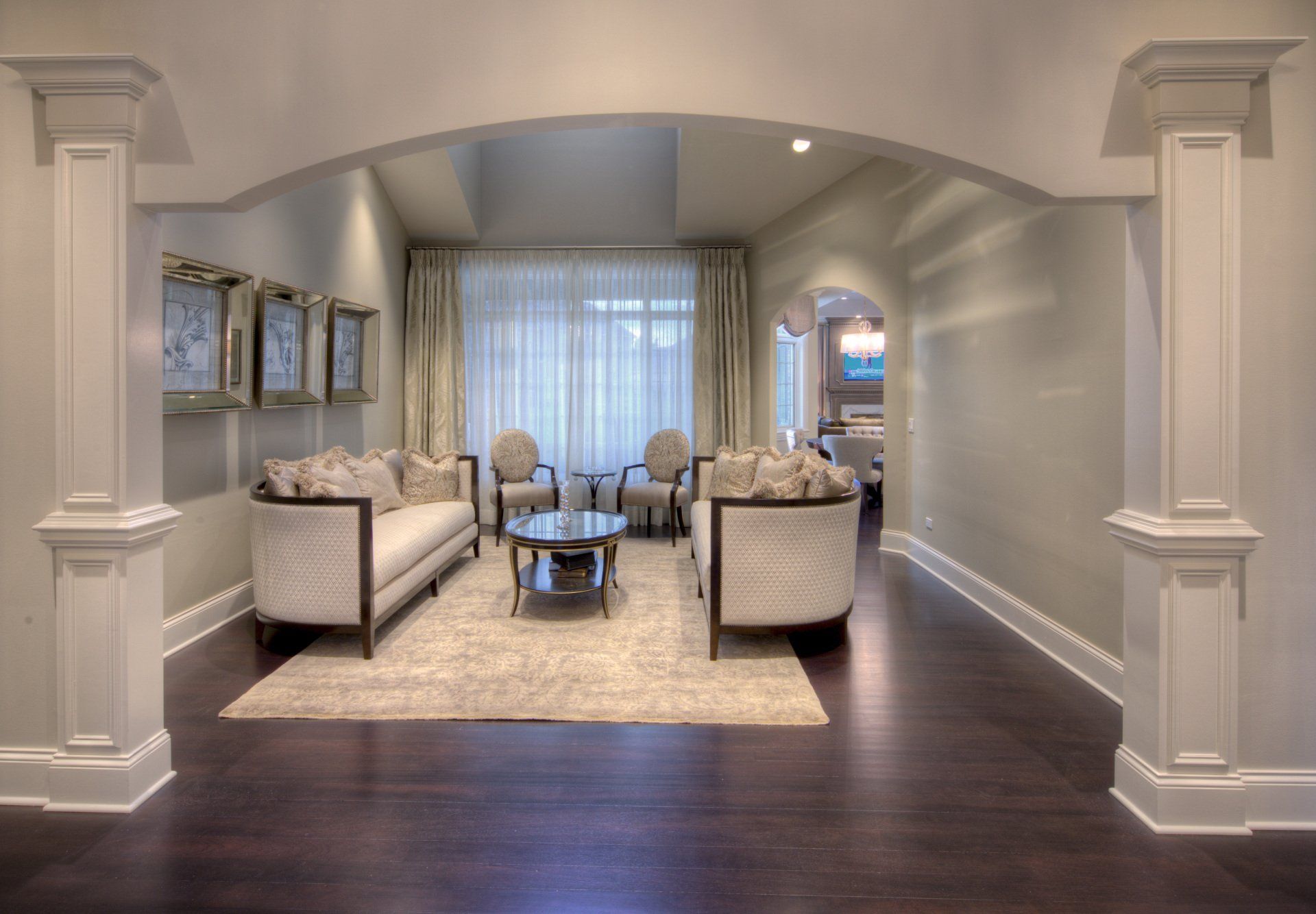 A living room with a couch , chairs and a coffee table