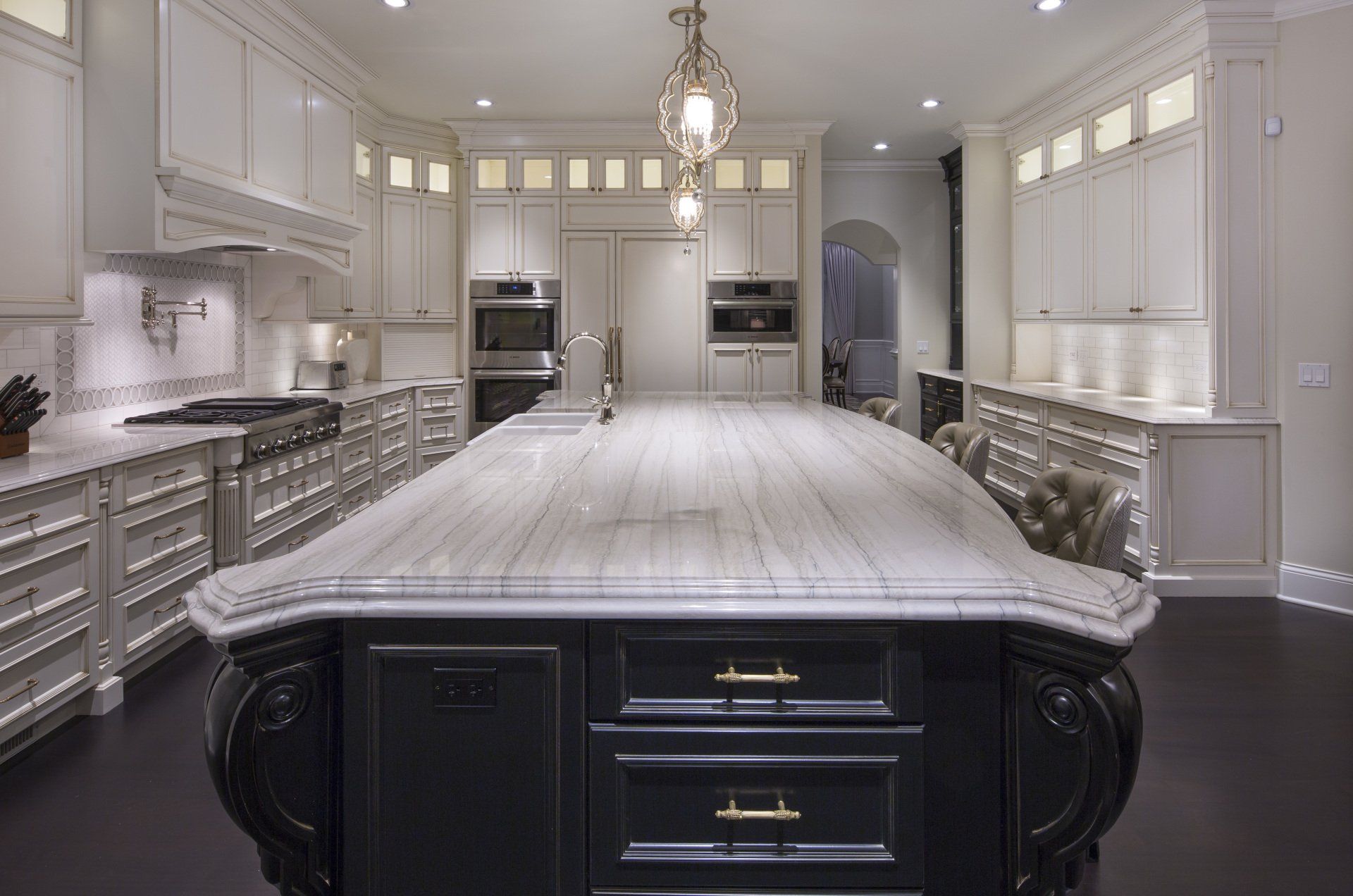 A kitchen with a large island in the middle of it.