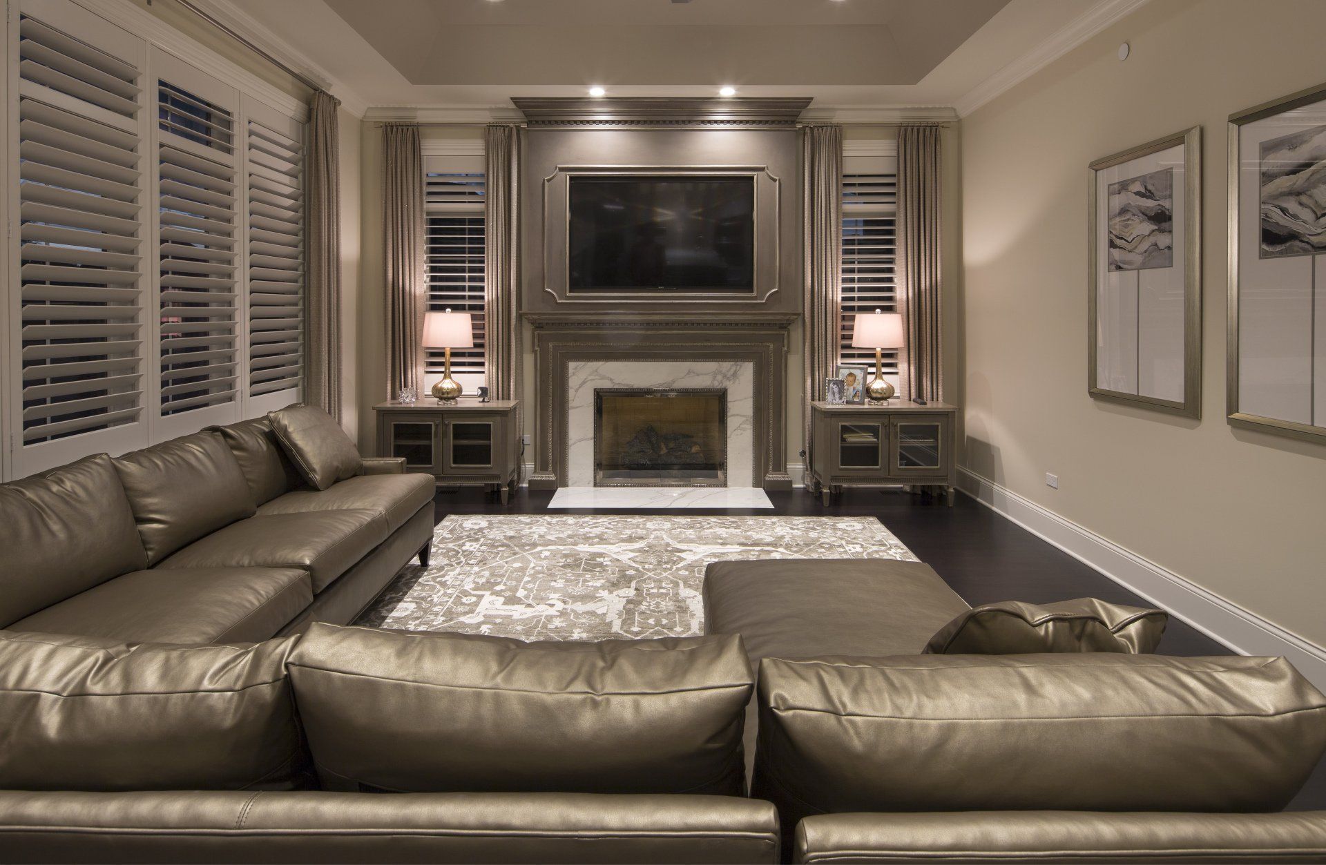A living room with a fireplace and a flat screen tv