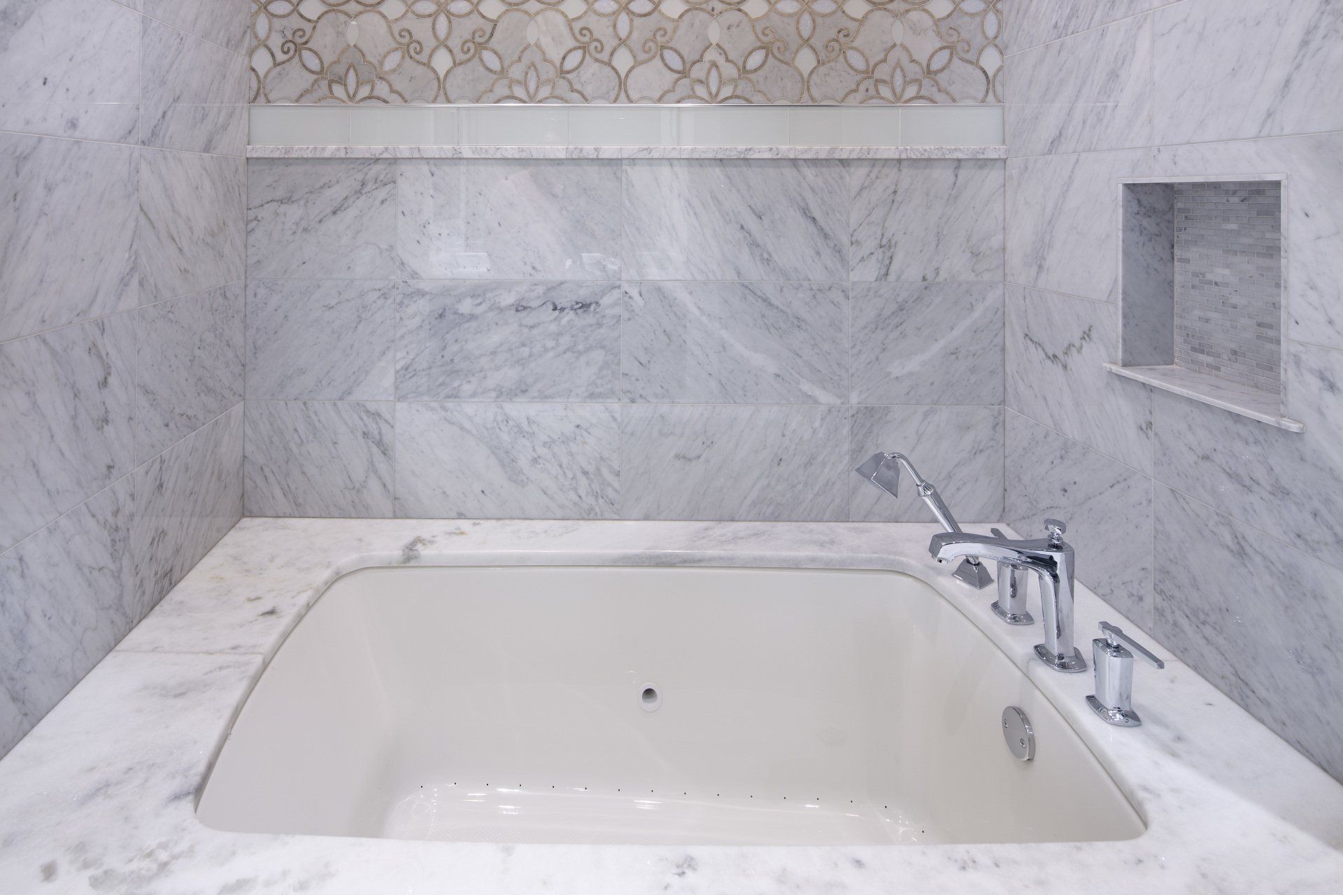 There is a bathtub in the middle of the bathroom.