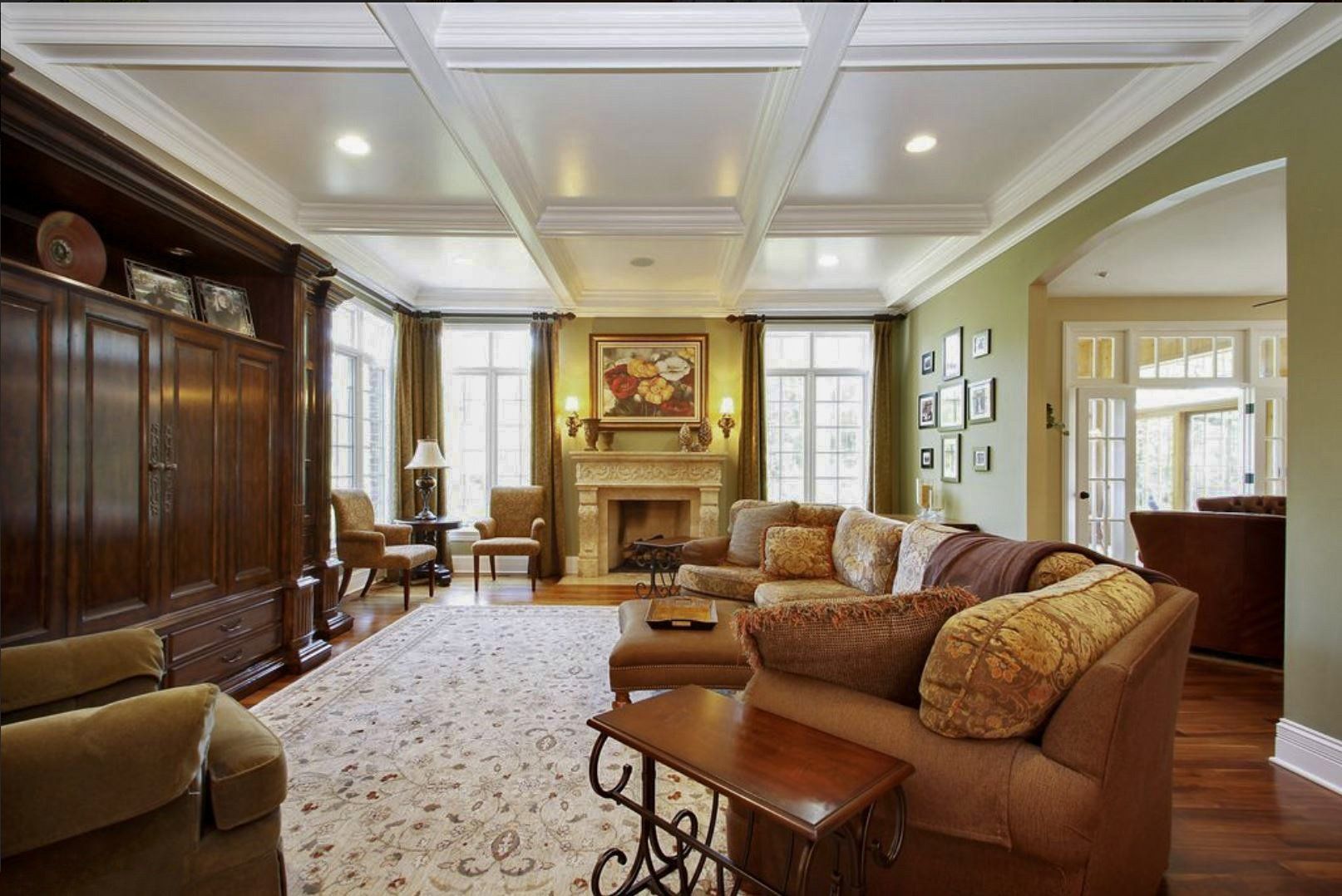 A living room filled with furniture and a fireplace.