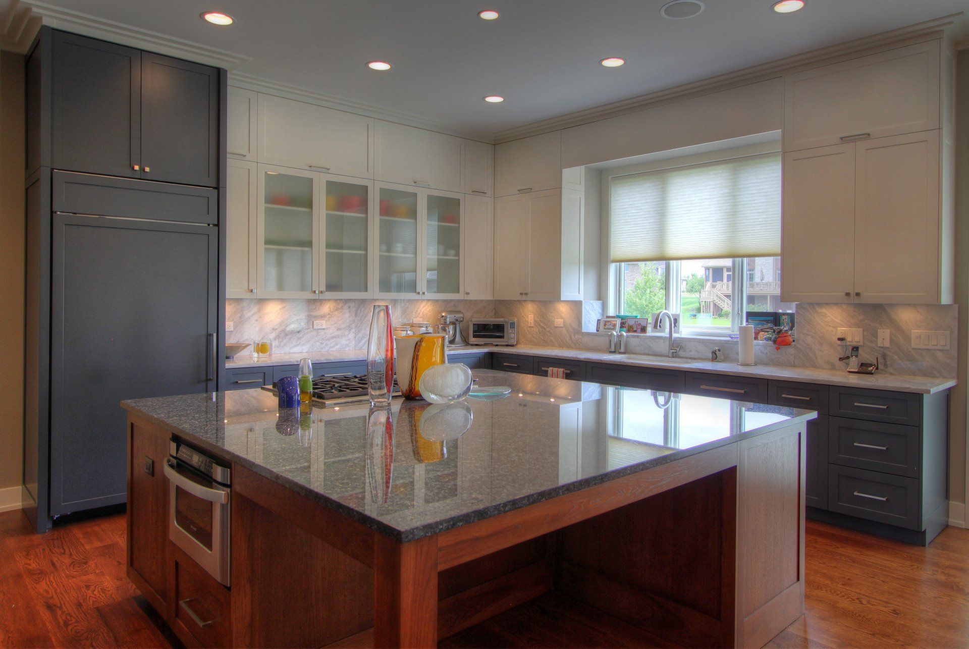 There is a large island in the middle of the kitchen.