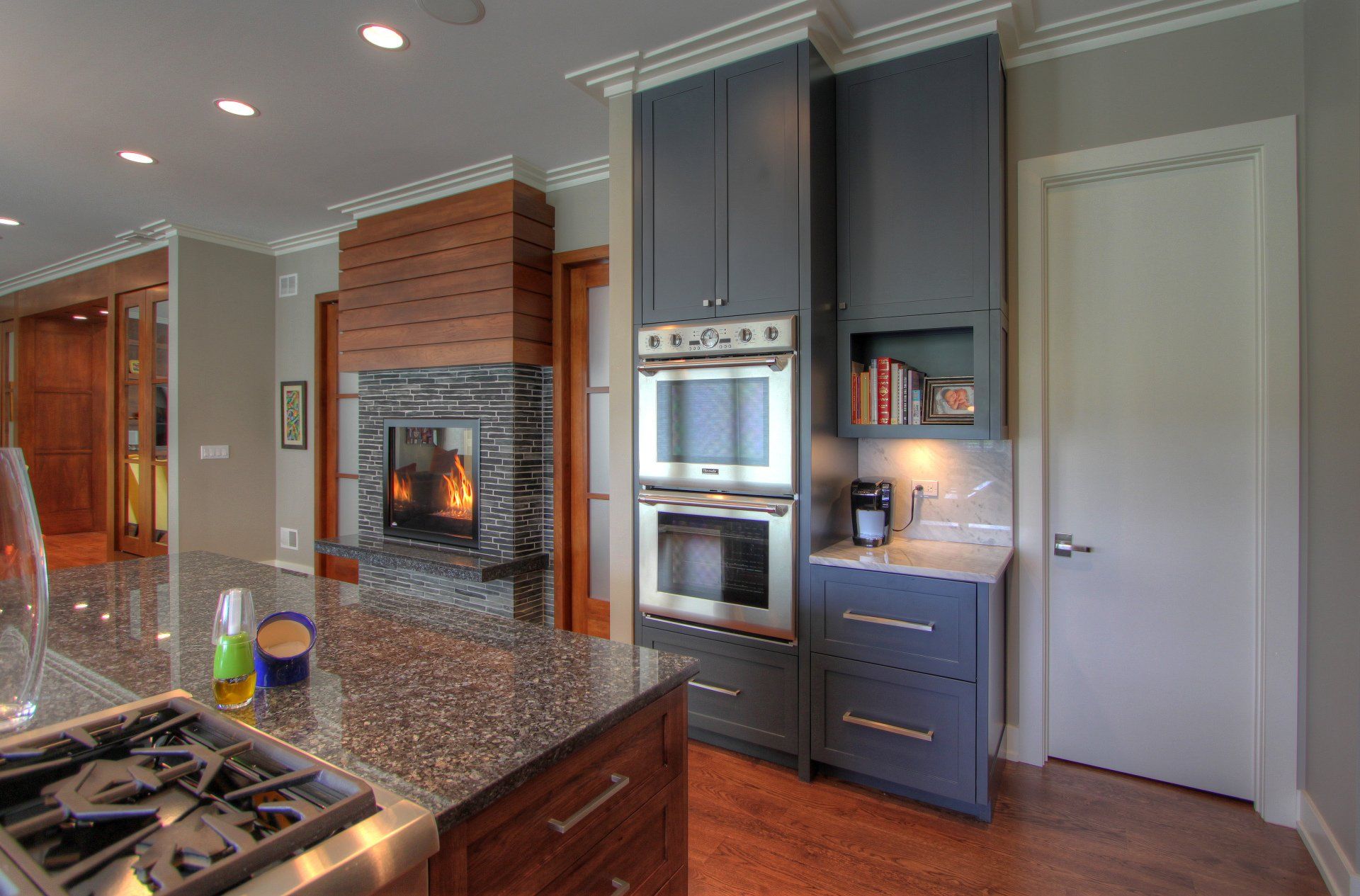 A kitchen with stainless steel appliances and granite counter tops