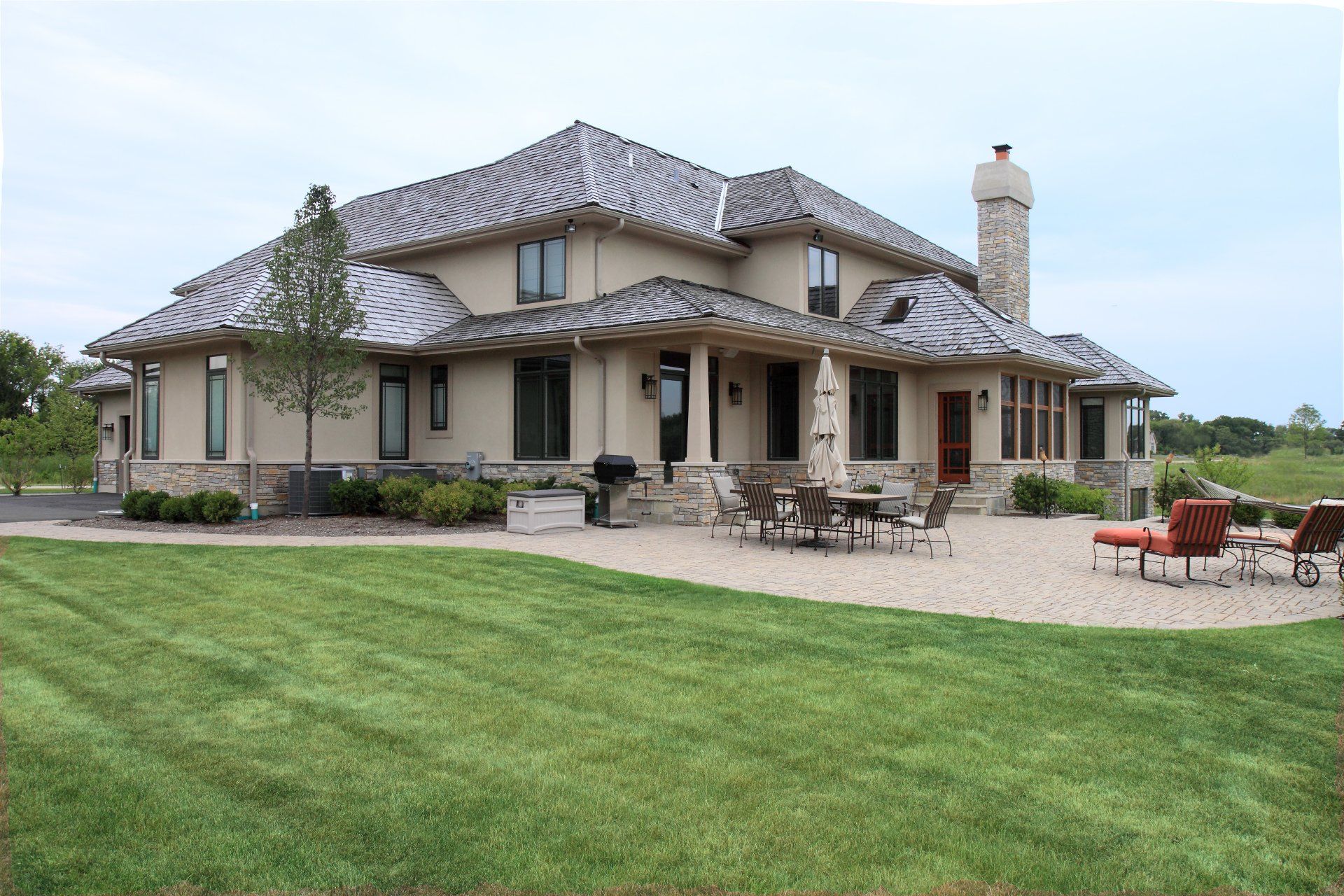 A large house with a large lawn in front of it