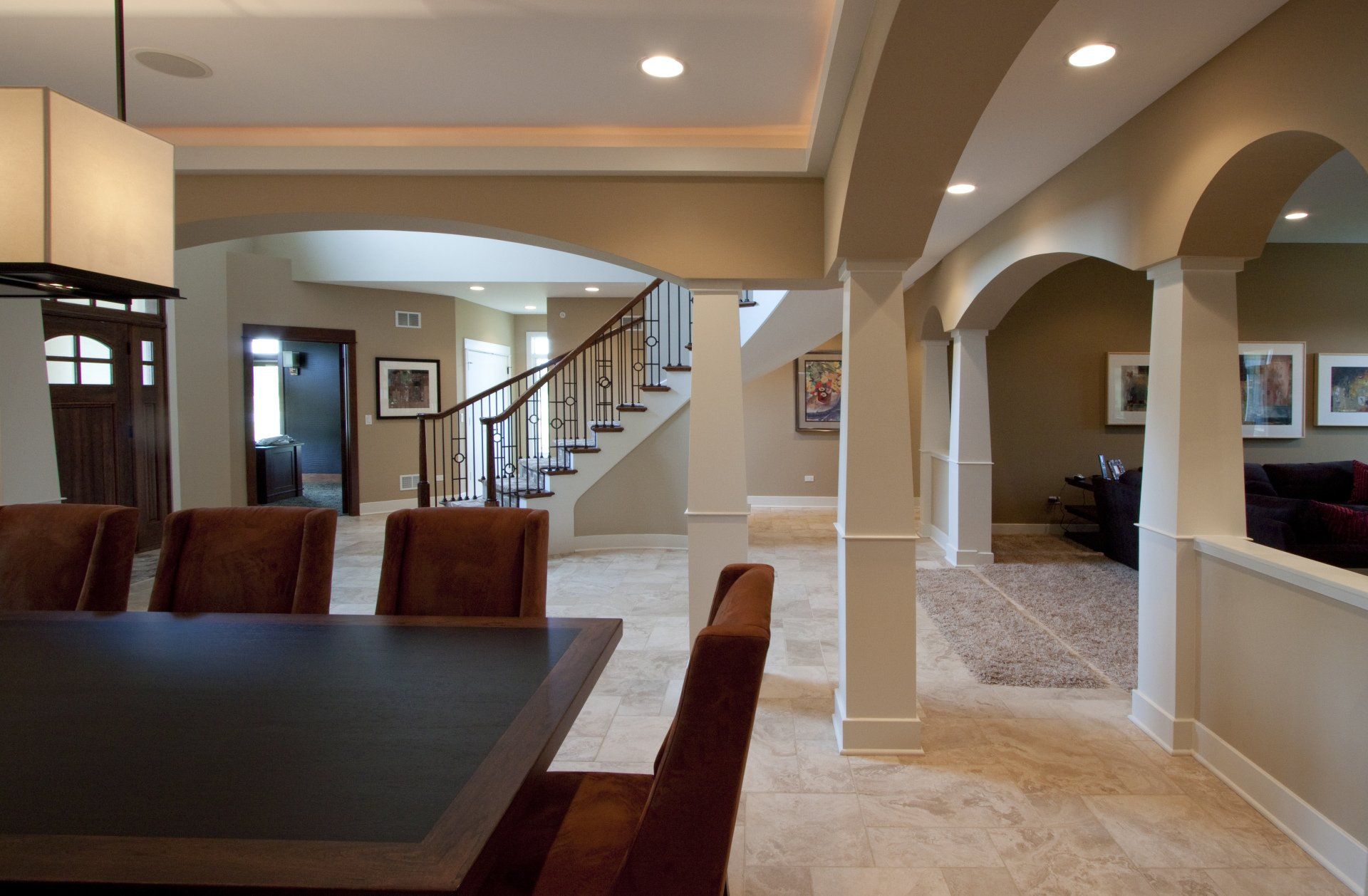 A dining room in a house with a table and chairs
