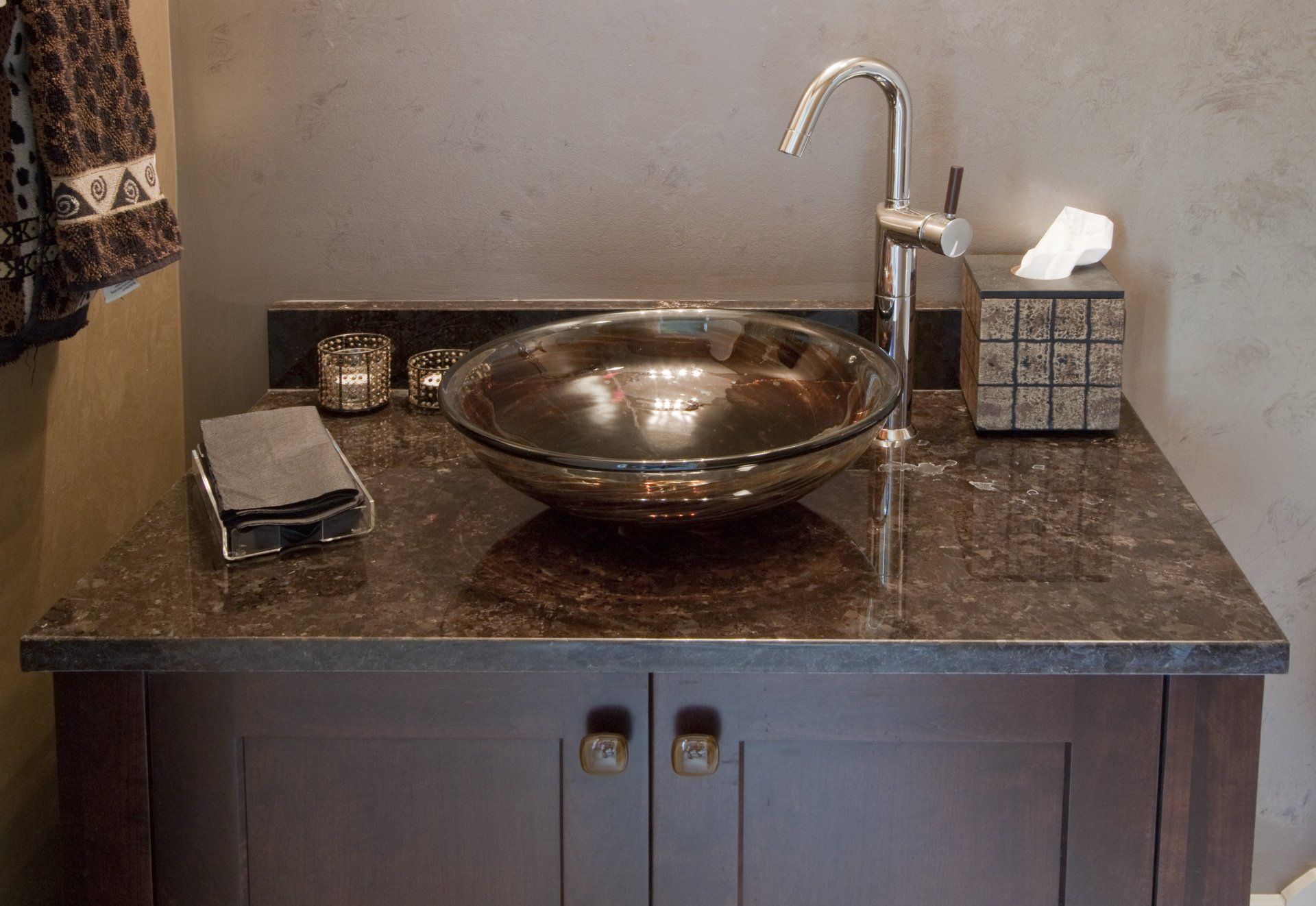 A bathroom with a sink and a tissue box