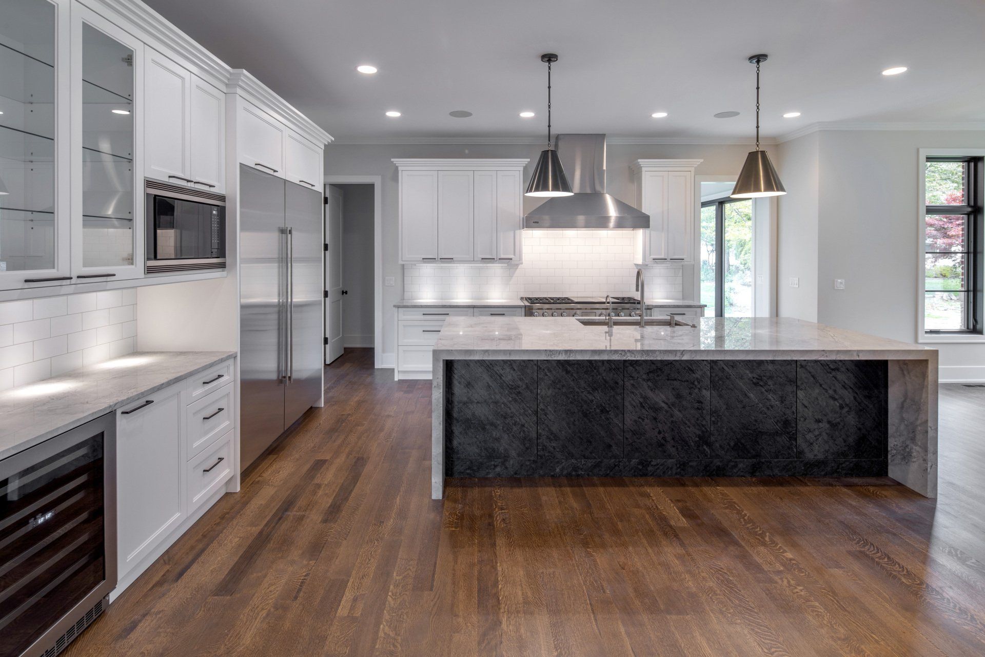 There is a large island in the middle of the kitchen.