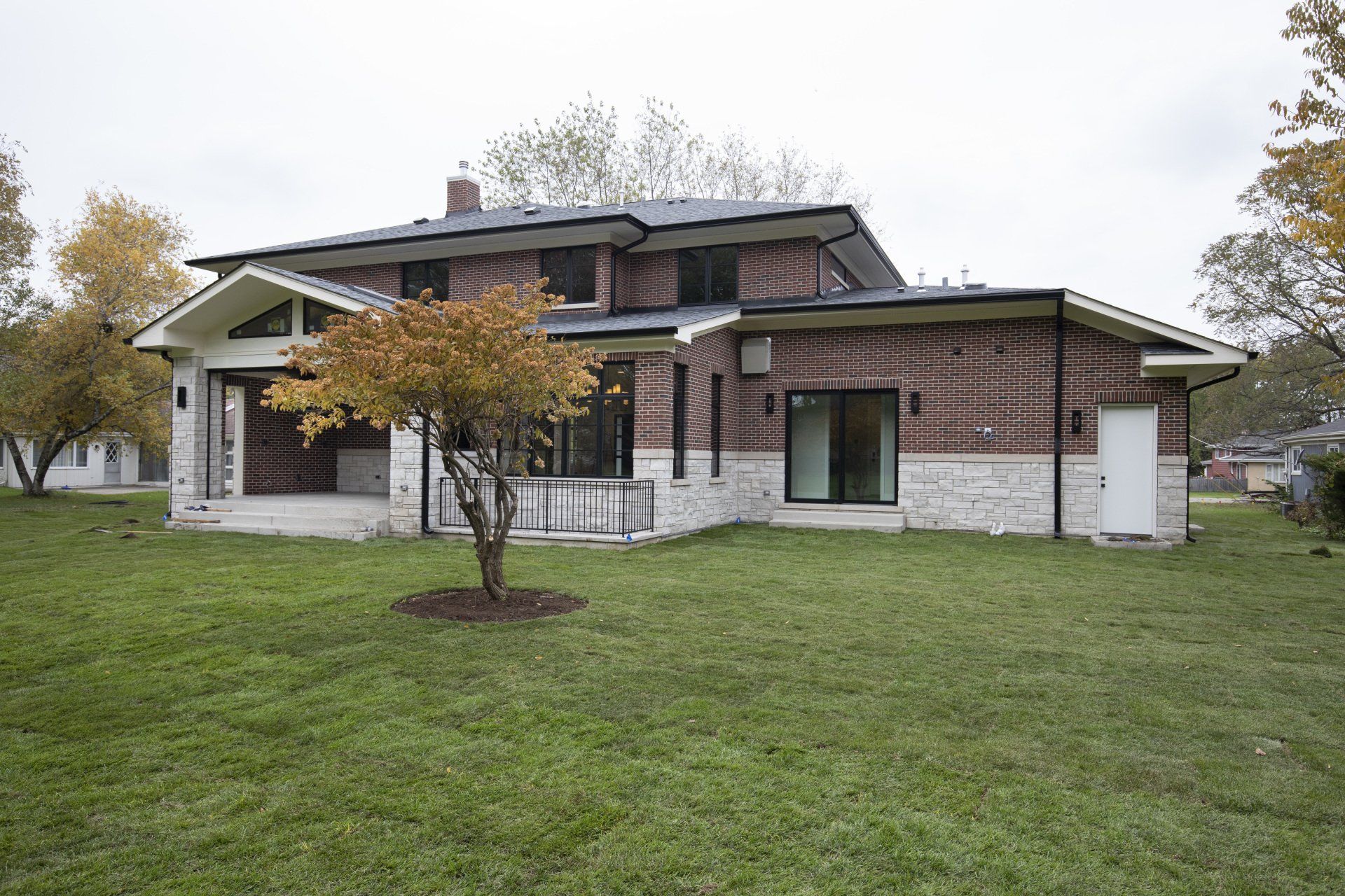 A large house with a large lawn in front of it.