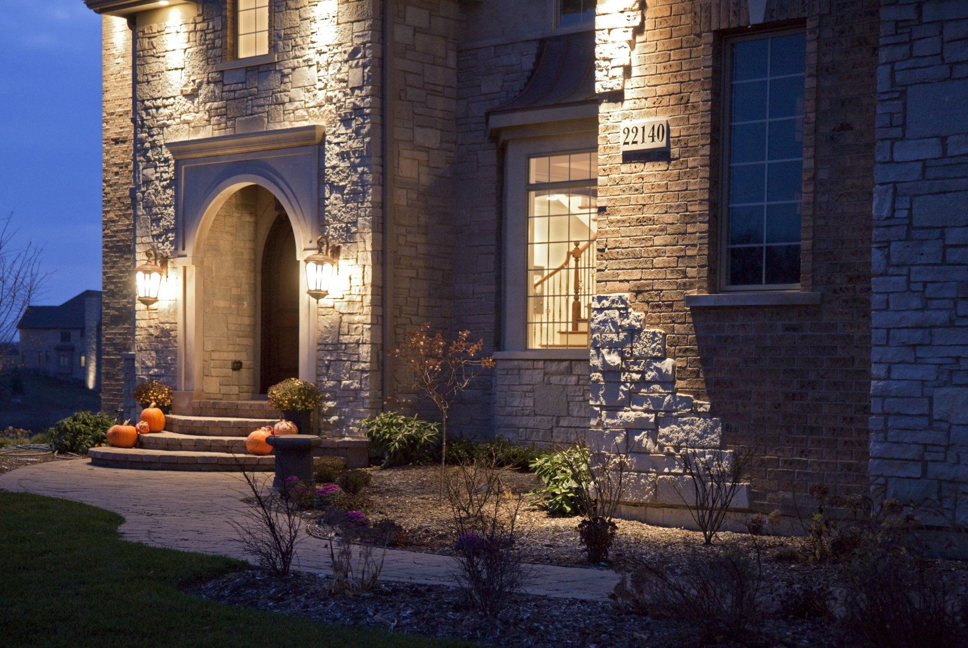 A brick house with the number 2121 on the side of it