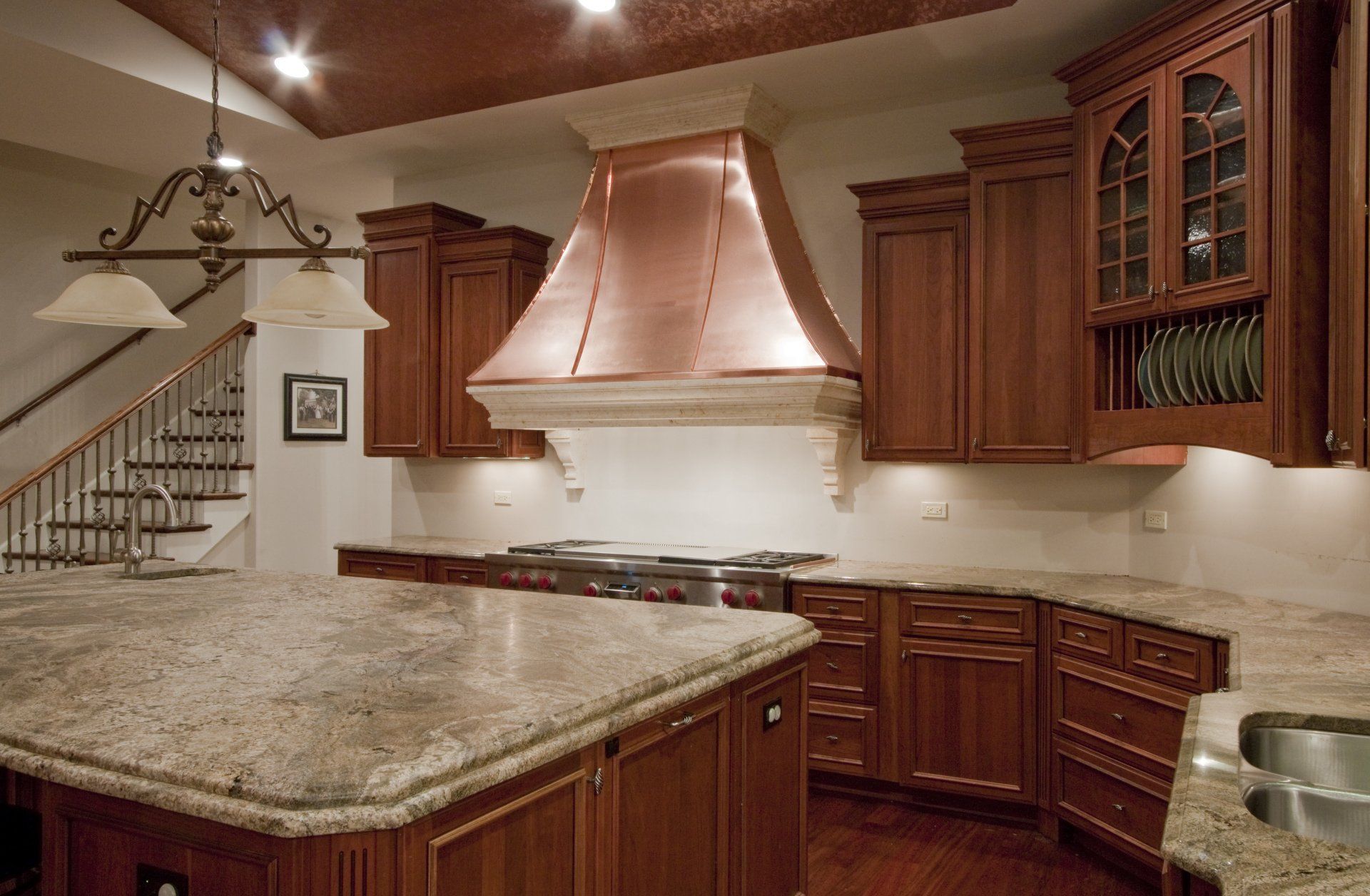A kitchen with wooden cabinets and granite counter tops