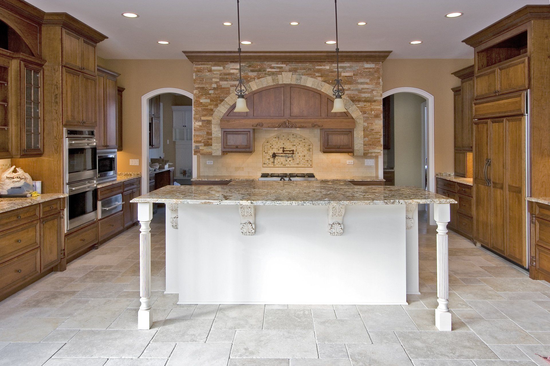 A large kitchen with a large island in the middle