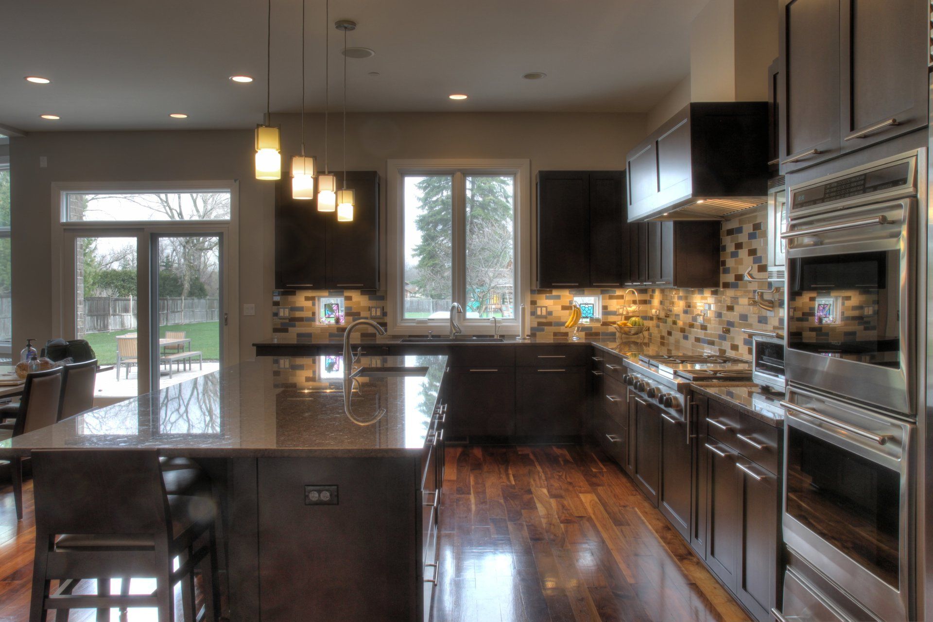 A kitchen with stainless steel appliances and a large island
