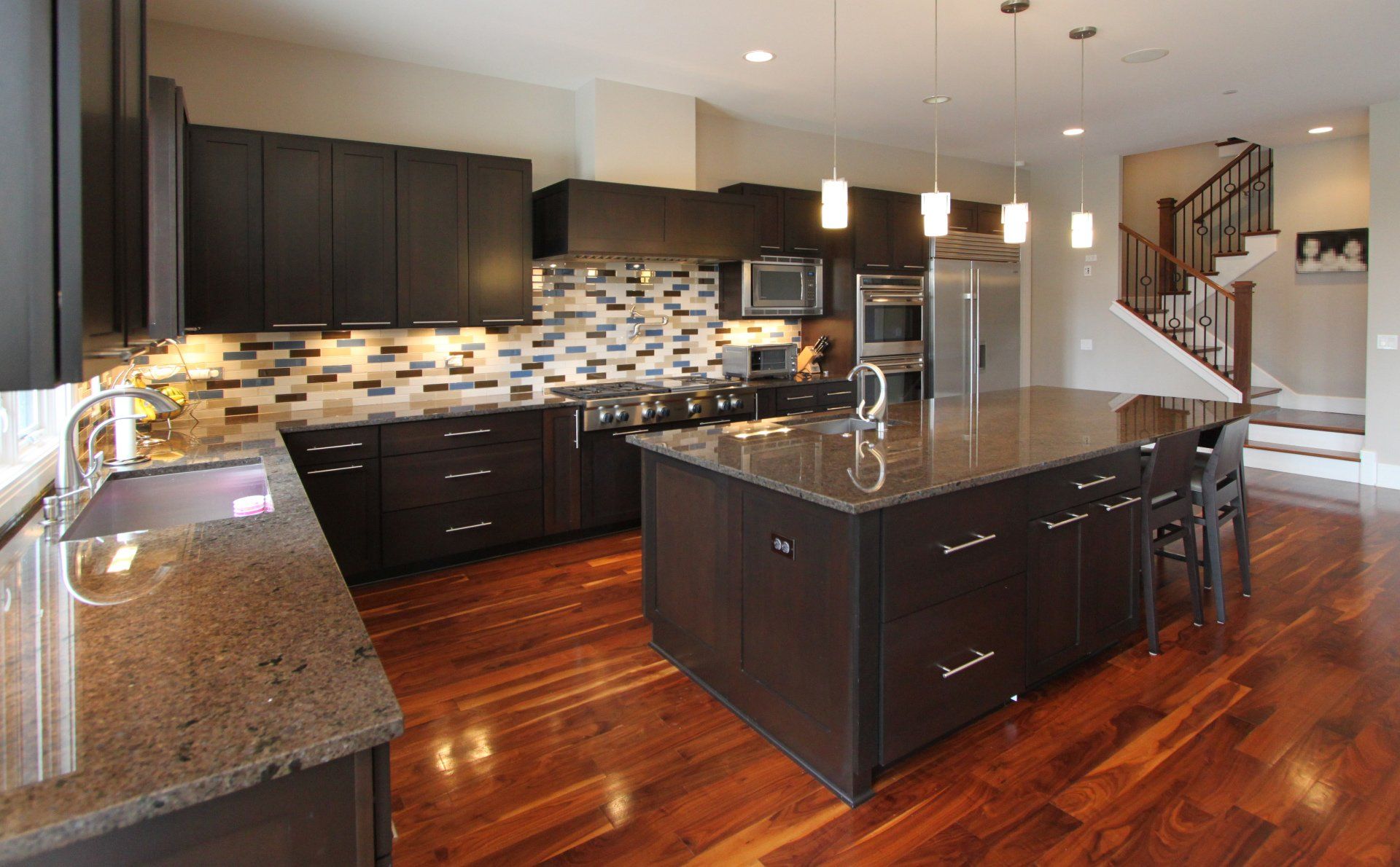 A kitchen with a large island in the middle of it